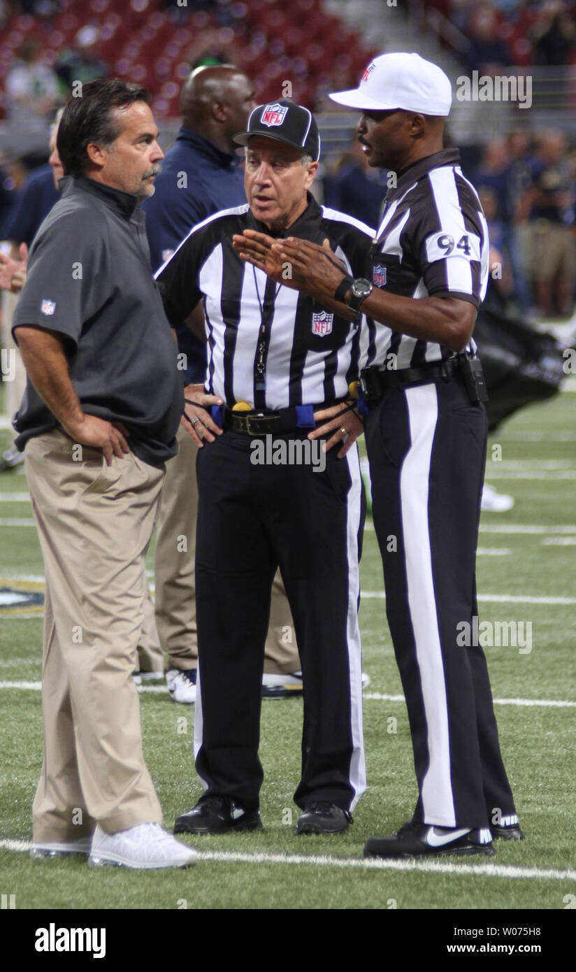 St. Louis Rams head coach Steve Fischer talks to officials Chad Brown