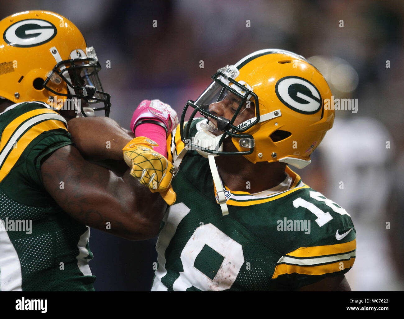 Green Bay Packers James Jones (L) and Randall Cobb lock arms after Cobb caught a touchdown pass in the fourth quarter against the St. Louis Rams at the Edward Jones Dome in St. Louis on October 21, 2012.  Green Bay won the game 30-20.     UPI/Bill Greenblatt Stock Photo