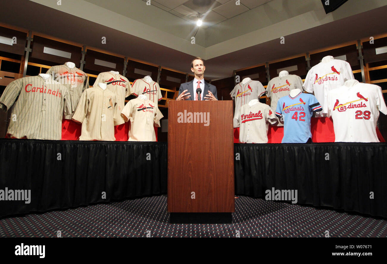 St. Louis Cardinals President Bill DeWitt III stands among some of the