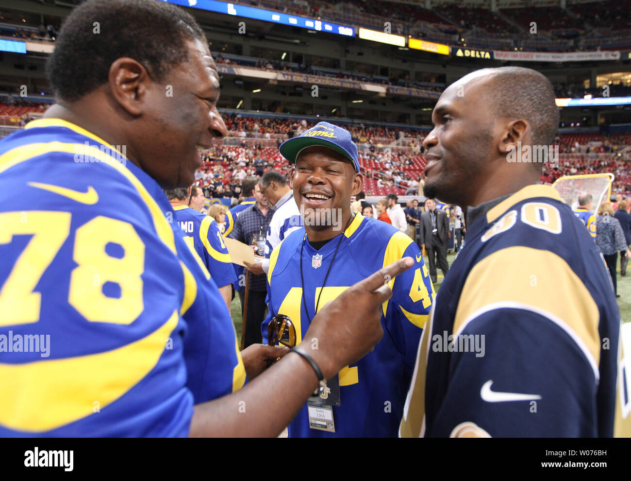 Former Los Angeles Rams players (L to R) Jackie Slater, LeRoy Irvin and  Issac Bruce share a laugh before the San Francisco 49ers -St. Louis Rams  football game at the Edward Jones