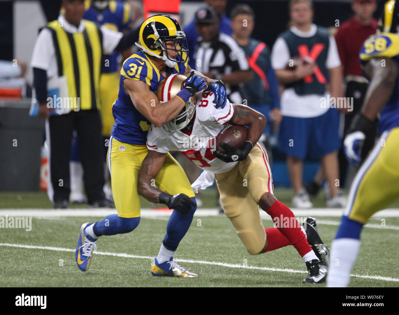 Tennessee Titans Cortland Finnegan intercepts a St. Louis Rams Sam Bradford  pass in the first quarter