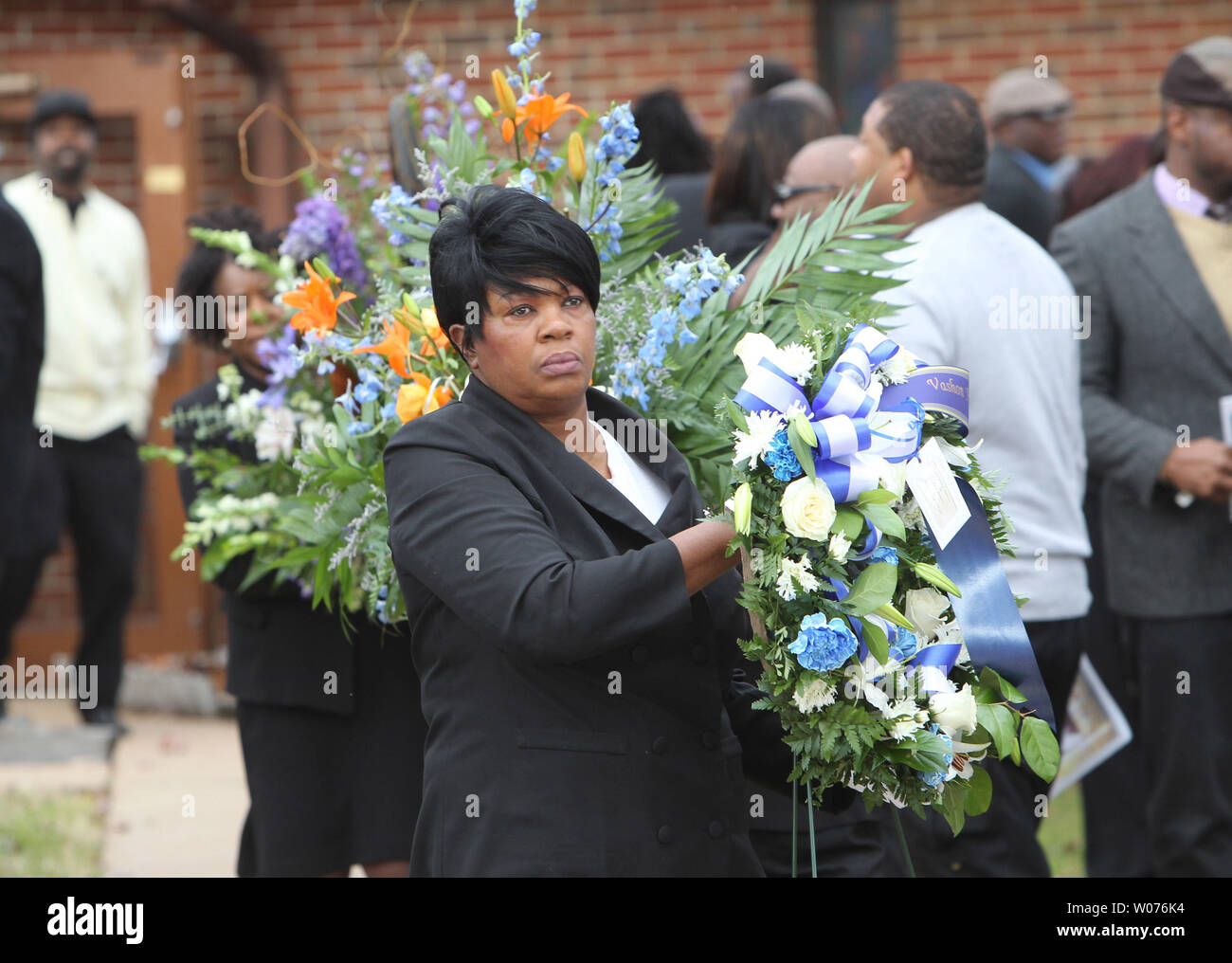 Officials bring flowers behind the casket of Jerry Brown, Jr. during his funeral at the Hopewell Missionary Baptist Church in St. Louis on December 15, 2012. The Dallas CowboysÕ practice squad nose tackle was killed in an Irving car accident on December 8, 2012 when his best friend and teammate Josh Brent hit a curb, flipping the vehicle.    UPI/Bill Greenblatt Stock Photo