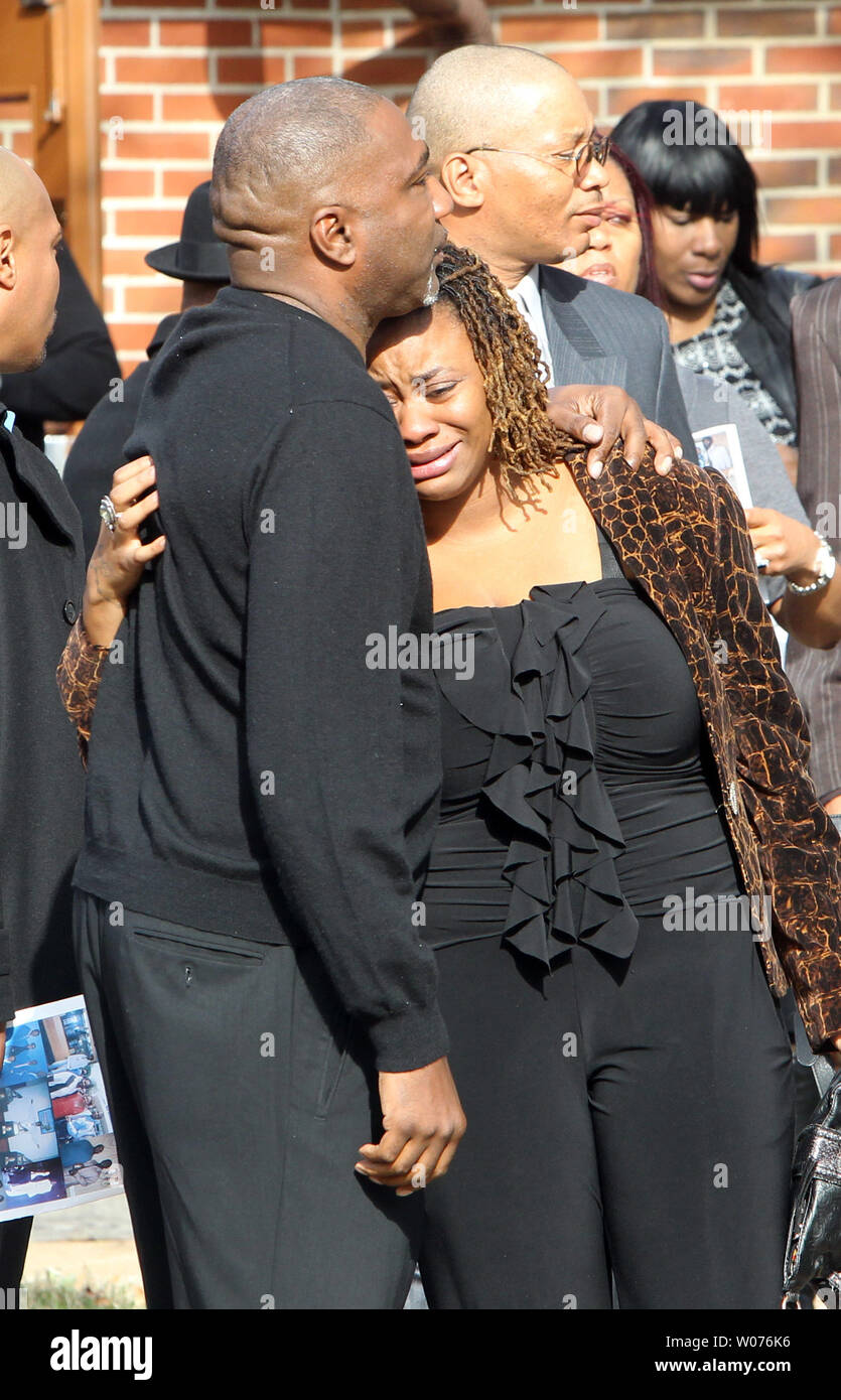 Mourners weep as they leave the funeral of Jerry Brown, Jr. at the Hopewell Missionary Baptist Church in St. Louis on December 15, 2012. The Dallas CowboysÕ practice squad nose tackle was killed in an Irving car accident on December 8, 2012 when his best friend and teammate Josh Brent hit a curb, flipping the vehicle.    UPI/Bill Greenblatt Stock Photo