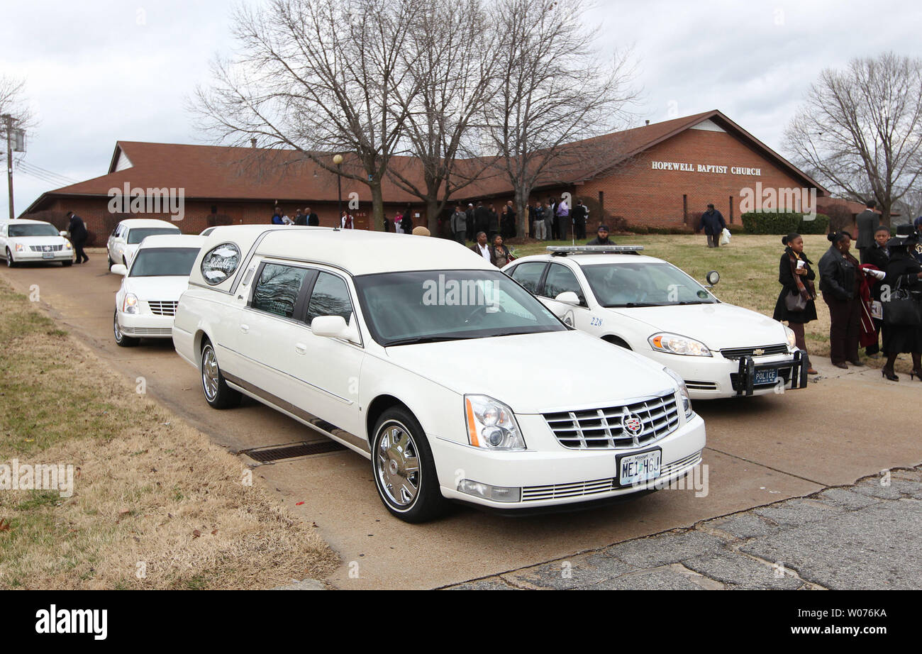 A white hearse leads the way carrying the casket of Jerry Brown Jr. from the Hopewell Missionary Baptist Church in St. Louis on December 15, 2012. The Dallas CowboysÕ practice squad nose tackle was killed in an Irving car accident on December 8, 2012 when his best friend and teammate Josh Brent hit a curb, flipping the vehicle.    UPI/Bill Greenblatt Stock Photo