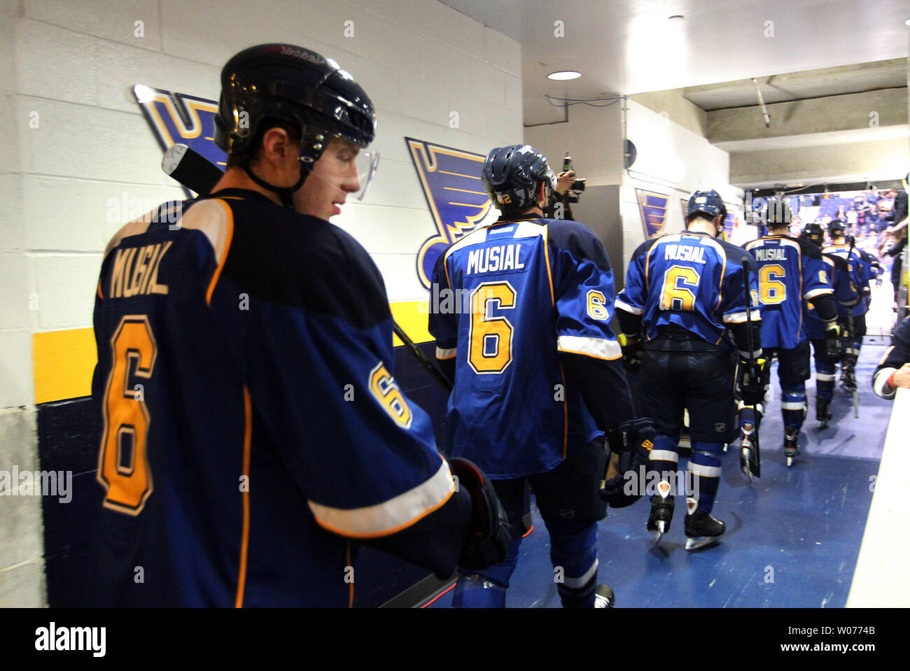 St. Louis Blues players leave the dressing room for warm-ups all wearing  the same number six jerseys and the name Musial in honor of Stan Musial  before a game against the Minnesota