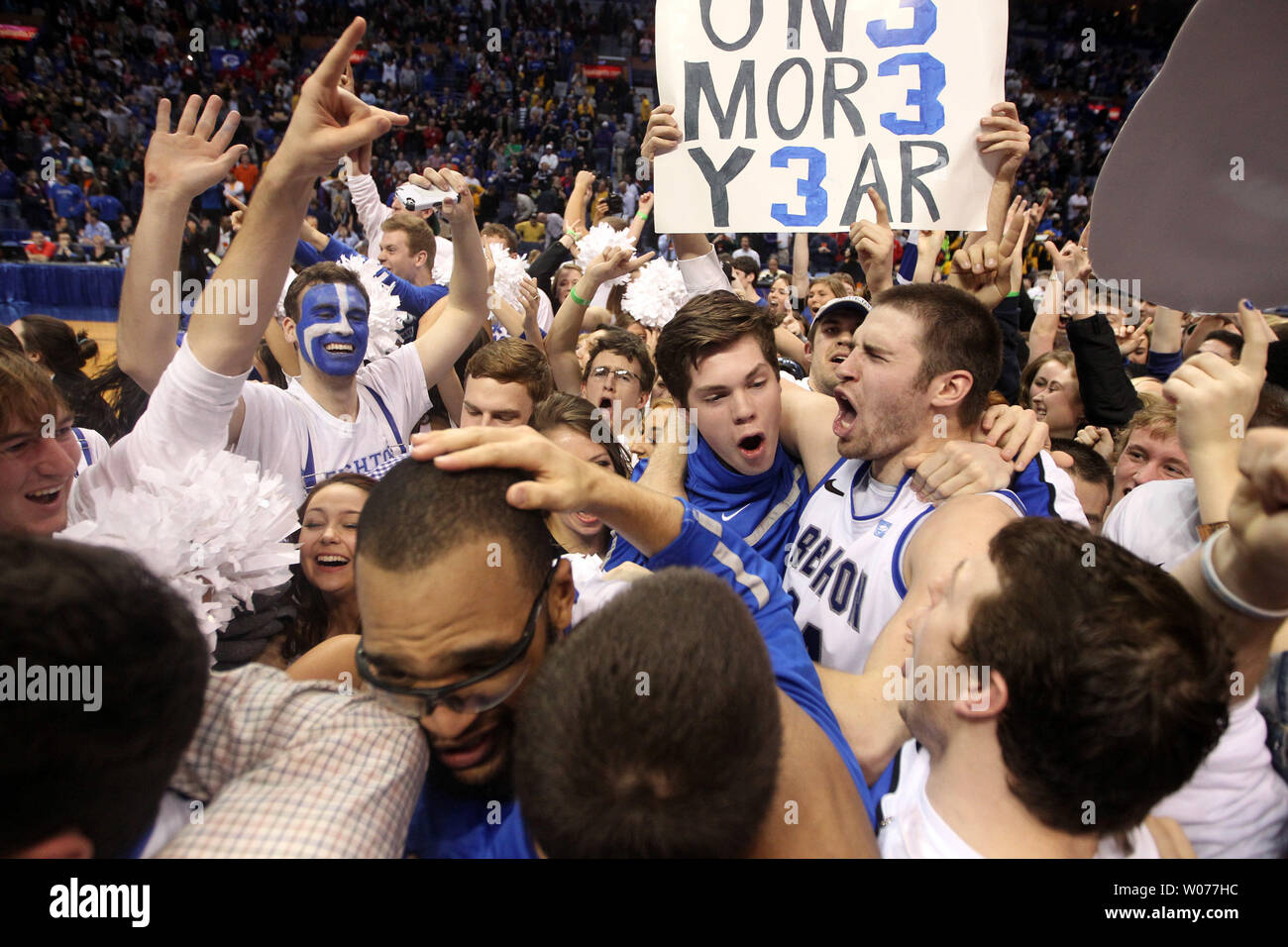 The Creighton Bluejays celebrate with their fans after winning the Missouri Valley Conference tournament defeating the Wichita State Shockers 68-65, at the Scottrade Center in St. Louis on March 10, 2013.    UPI/Bill Greenblatt Stock Photo