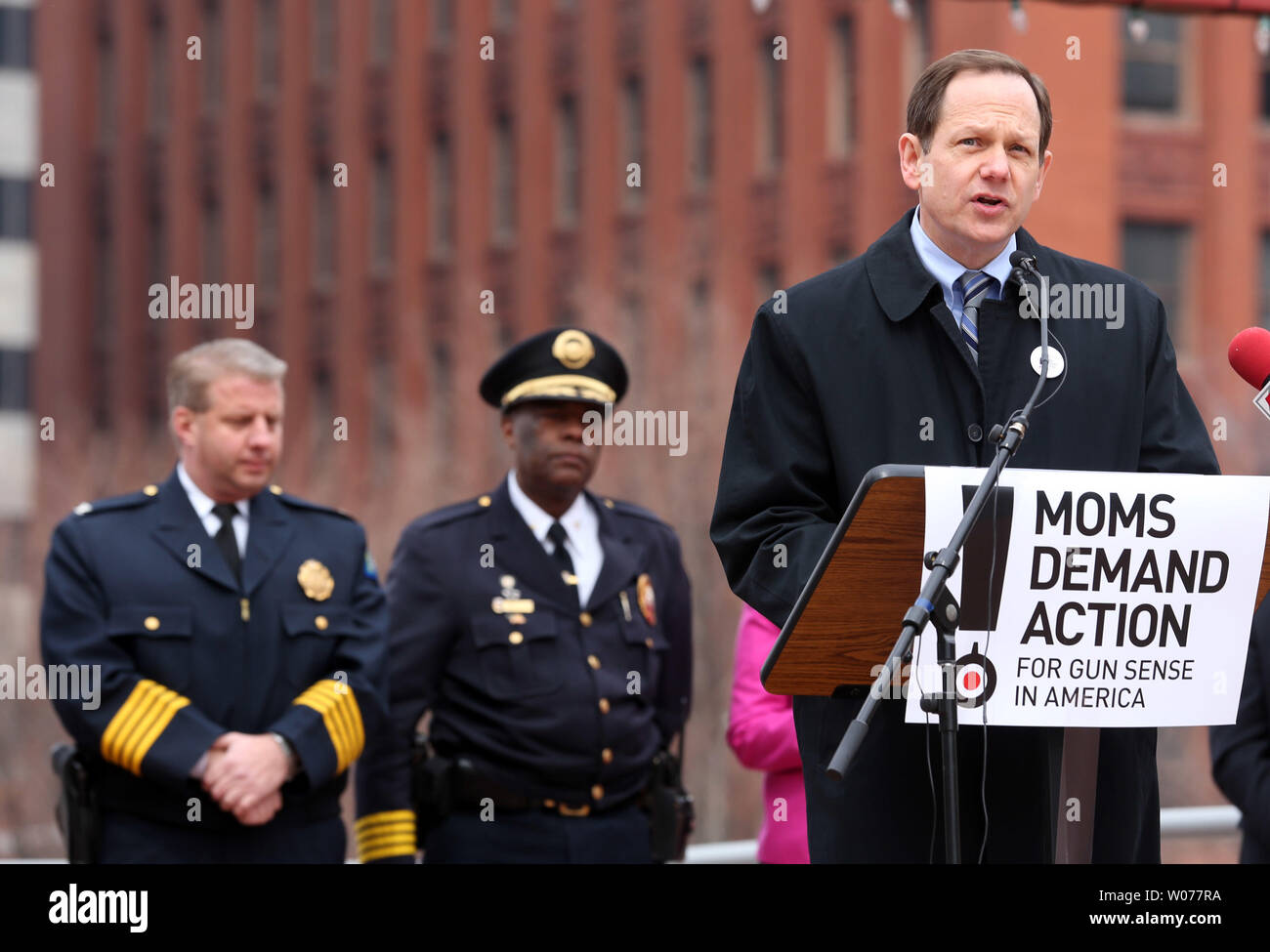 With law enforcement standing near, St. Louis Mayor Francis Slay speaks during a anti gun rally in downtown St. Louis on March 30, 2013. Political and religious leaders plus emergency room doctors spoke about the advantages of backround checks and outlawing large capacity ammunication clips. The rally was organized after a four-year old girl was shot in the shoulder as she stood on her porch in front of her St. Louis home. UPI/Bill Greenblatt Stock Photo