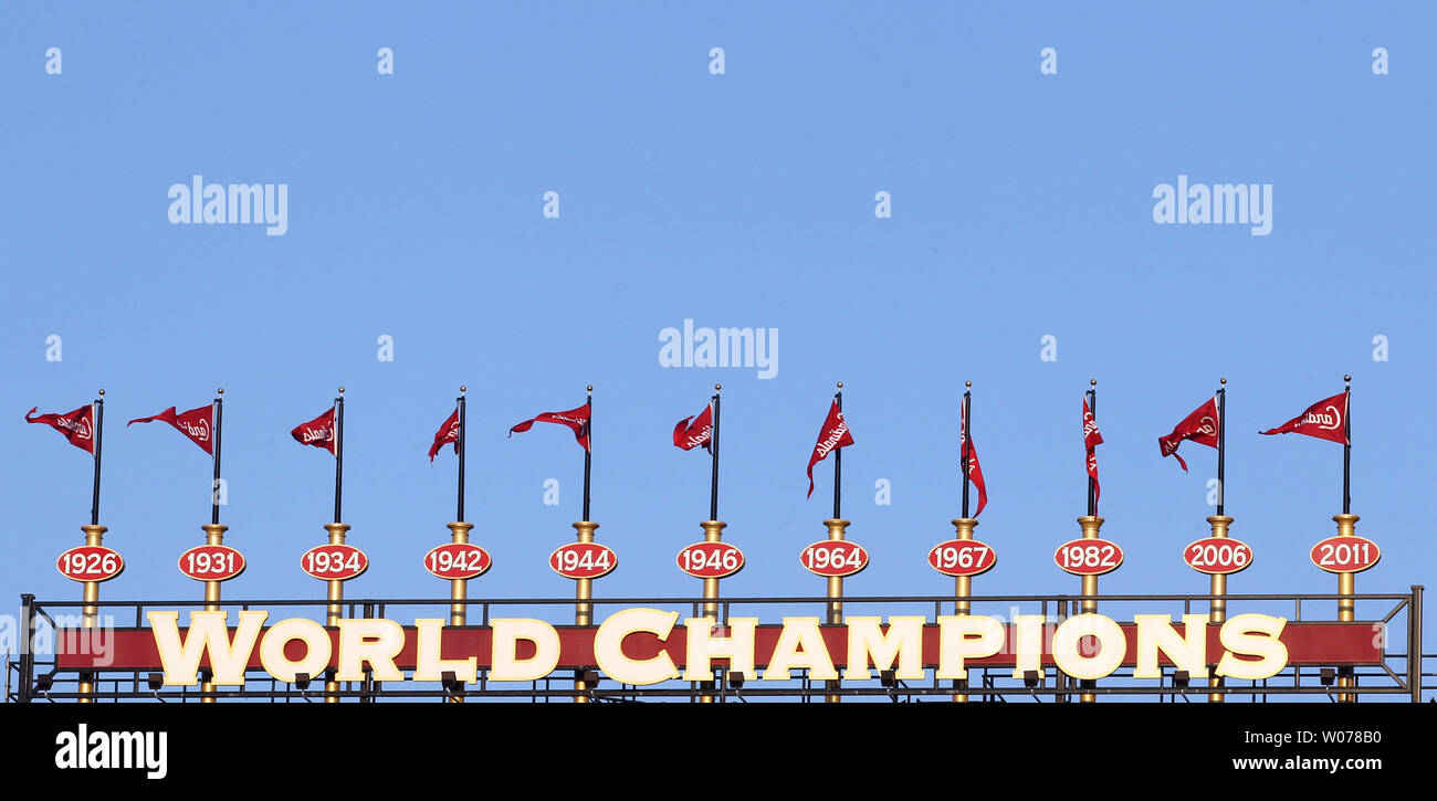 The World Championship flags blow atop Busch Stadium in a light breeze  before the Cincinnati Reds-St. Louis Cardinals baseball game at Busch  Stadium in St. Louis on April 29, 2013. UPI/Bill Greenblatt
