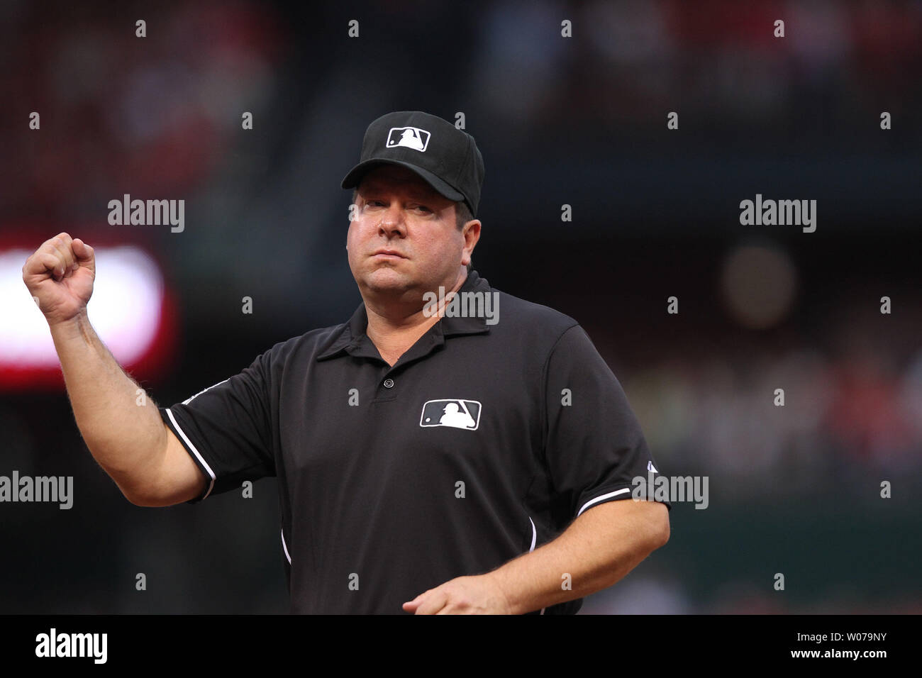 First base umpire Sam Holbrook calls an out in the first inning during ...