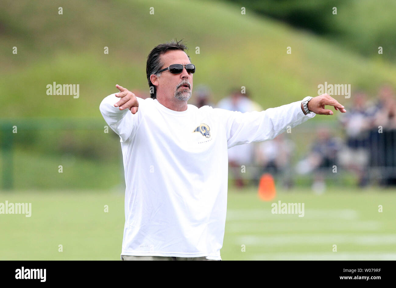 St. Louis Rams head football coach Jeff Fisher gives direction during training camp at the team practice facility in Earth City , Missouri on July 29, 2013.   UPI/Bill Greenblatt Stock Photo
