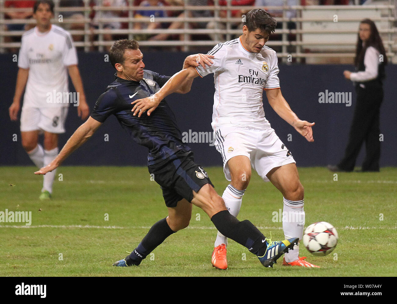 Inter Milan's Hugo Campagnaro (L) kicks the ball free from the leg of Real Madrid's Alvaro Morata  in the first half of a game at the Edward Jones Dome in St. Louis on August 10, 2013.    UPI/Bill Greenblatt Stock Photo