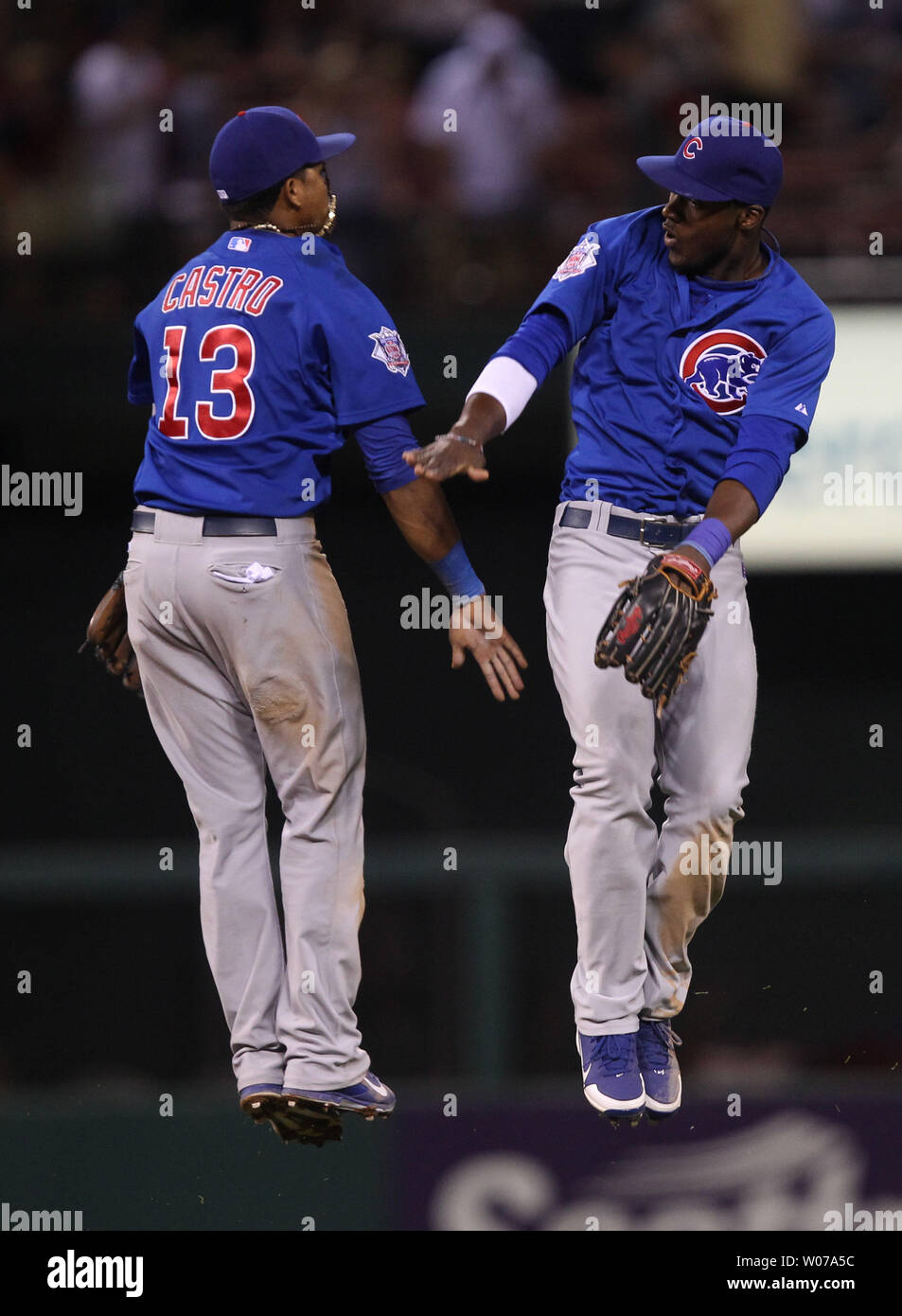 Chicago Cubs Starlin Castro and Junior Lake (R) jump to celebrate a 6-5 win over the St. Louis Cardinals at Busch Stadium in St. Louis on August 10, 2013. UPI/Bill Greenblatt Stock Photo