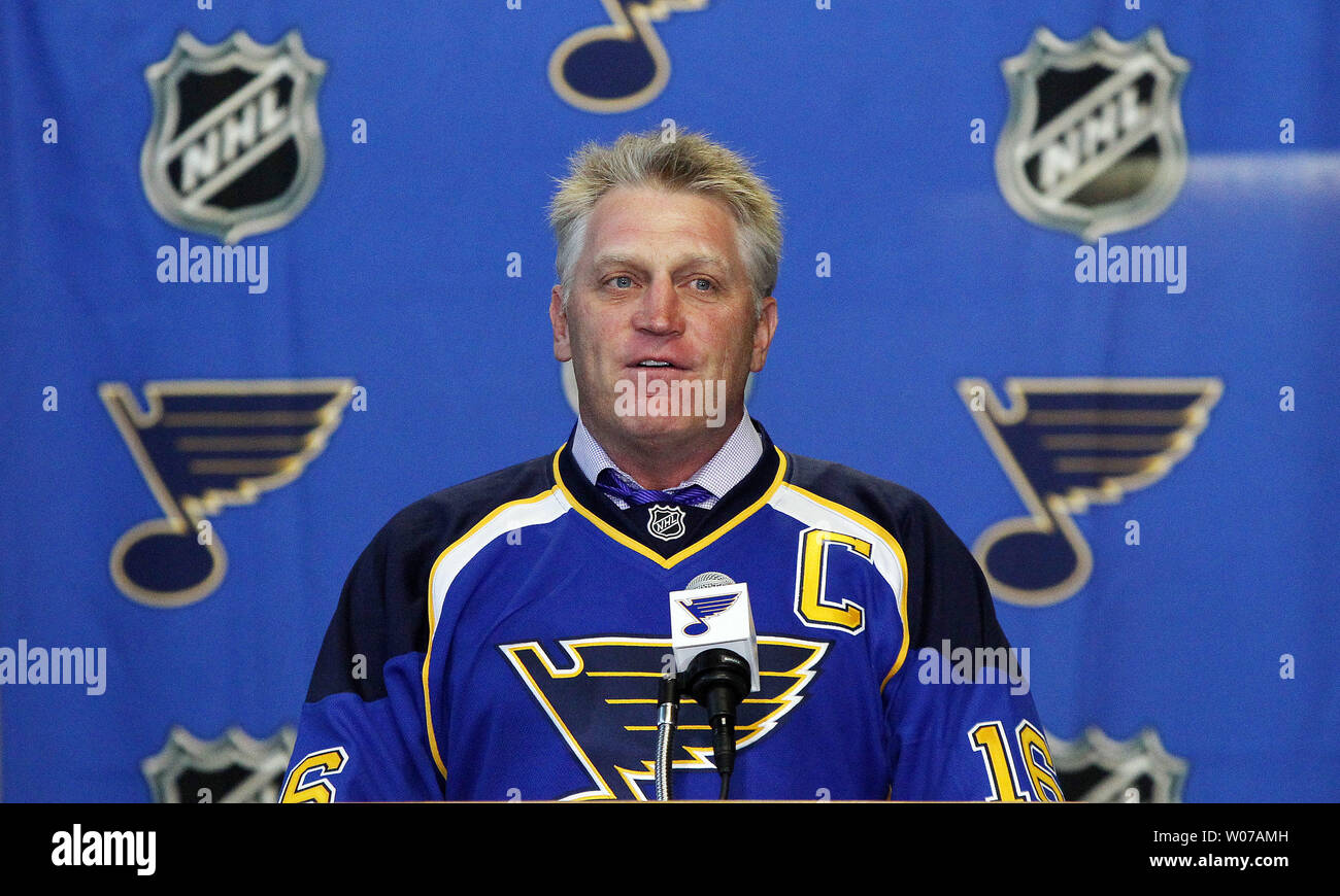 Former St. Louis Blues Brett Hull smiles as he does a television interview,  after being named Executive Vice President with the club, at the Scottrade  Center in St. Louis on September 9