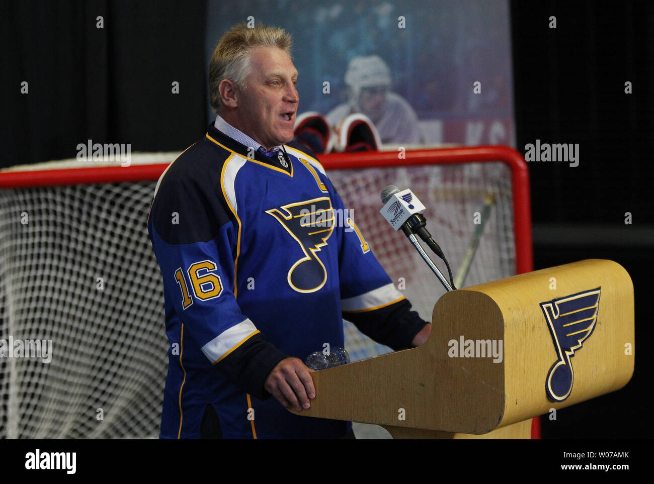 Former St. Louis Blues Brett Hull smiles as he does a television interview,  after being named Executive Vice President with the club, at the Scottrade  Center in St. Louis on September 9