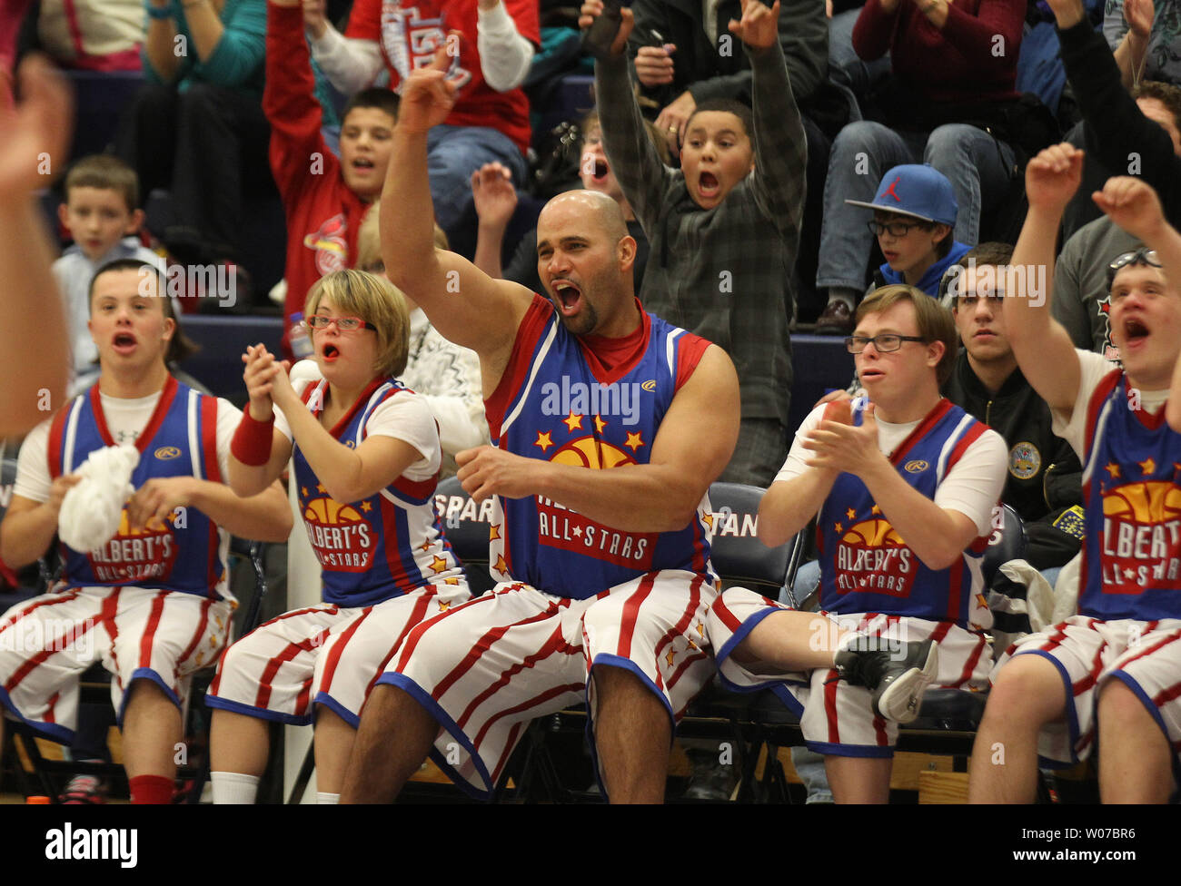 Anaheim Angels slugger Albert Pujols cheers on his team during the annual Albert  Pujols Basketball Shoot Out All Star Game in Town and Country, Missouri on  November 24, 2013. A special team