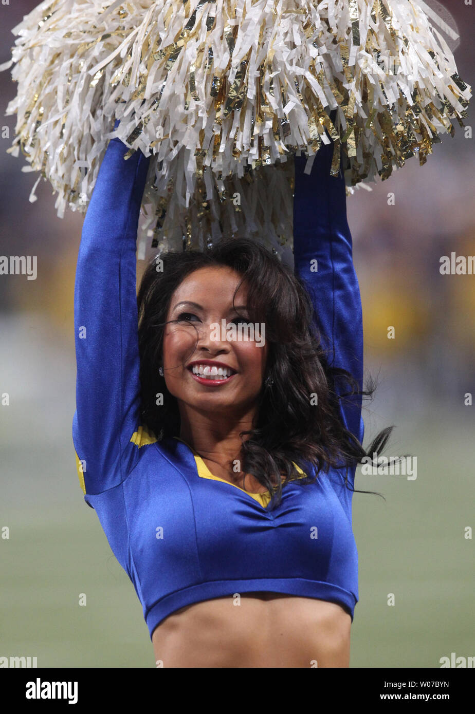 A St. Louis Rams cheerleader entertains the crowd during the fourth quarter against the Tampa Bay Buccaneers at the Edward Jones Dome in St. Louis on December 22, 2013.   UPI/Bill Greenblatt Stock Photo
