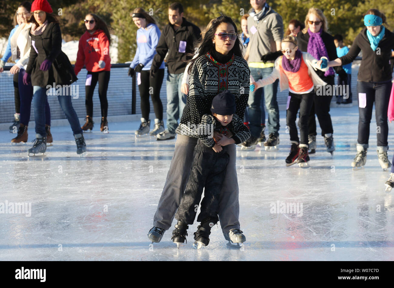 A Young Skater Gets Some Help At The Steinberg Rink In Forest Park