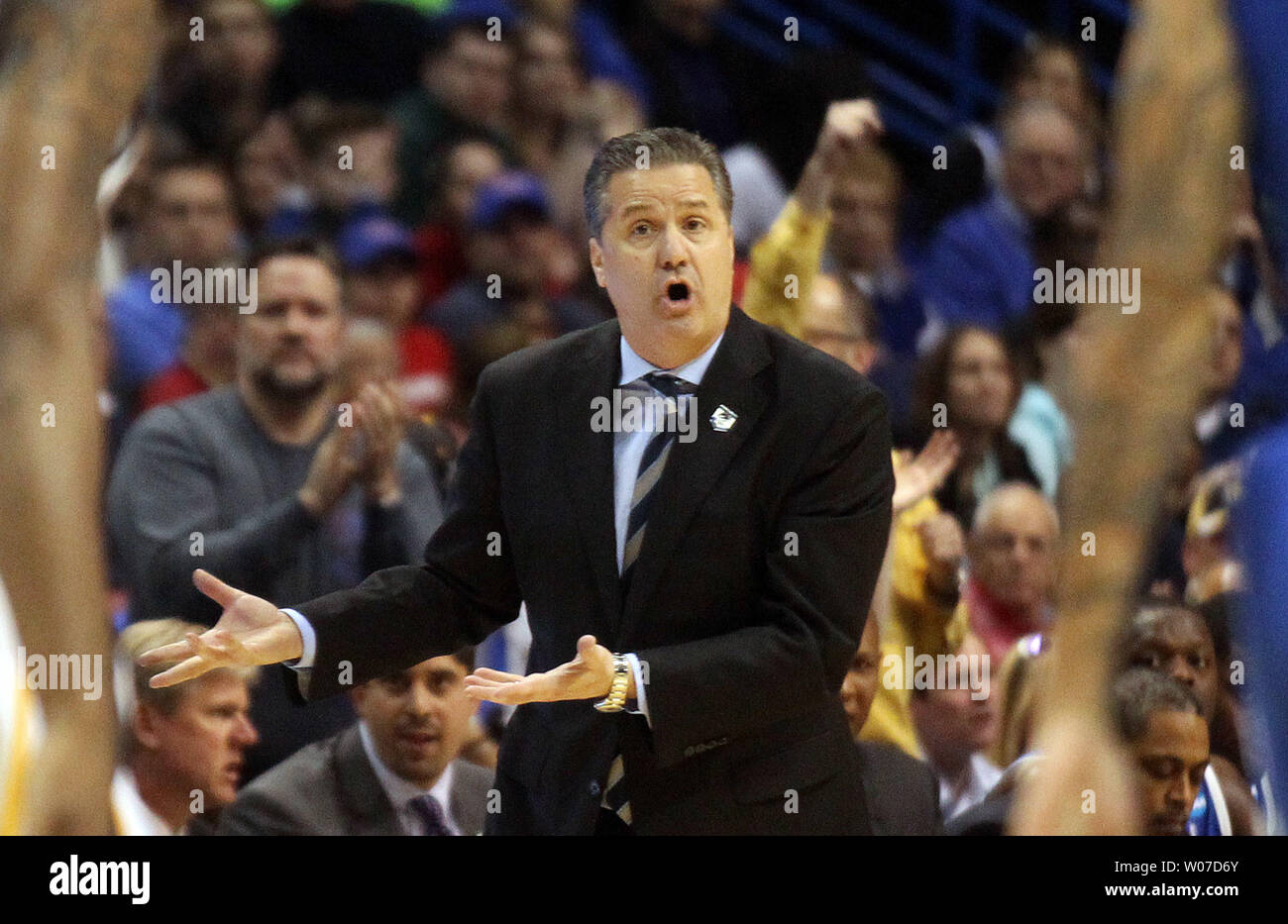 Kentucky Wildcats head basketball coach John Calipari gives his players instruction during the second half against the Wichita State Shockers in the NCAA Division 1 Men's Basketball Championship game at the Scottrade Center in St. Louis on March 23, 2014.  Kentucky won the game 78-76.   UPI/Bill Greenblatt Stock Photo