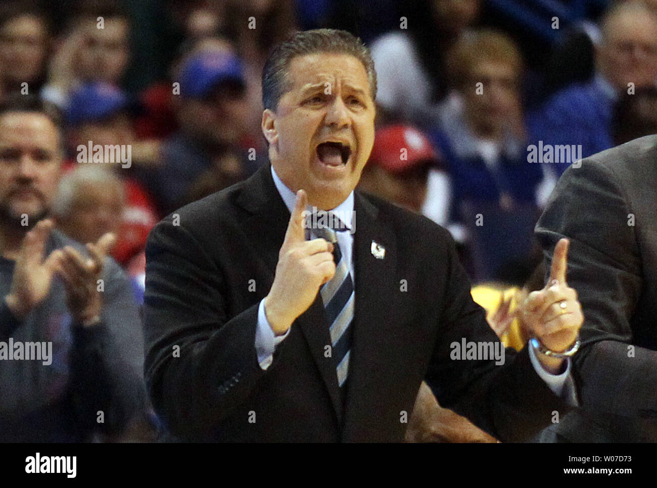 Kentucky Wildcats head basketball coach John Calipari gives his team instructions during the second half against the Wichita State Shockers in the NCAA Division 1 Men's Basketball Championship game at the Scottrade Center in St. Louis on March 23, 2014.   UPI/Bill Greenblatt Stock Photo