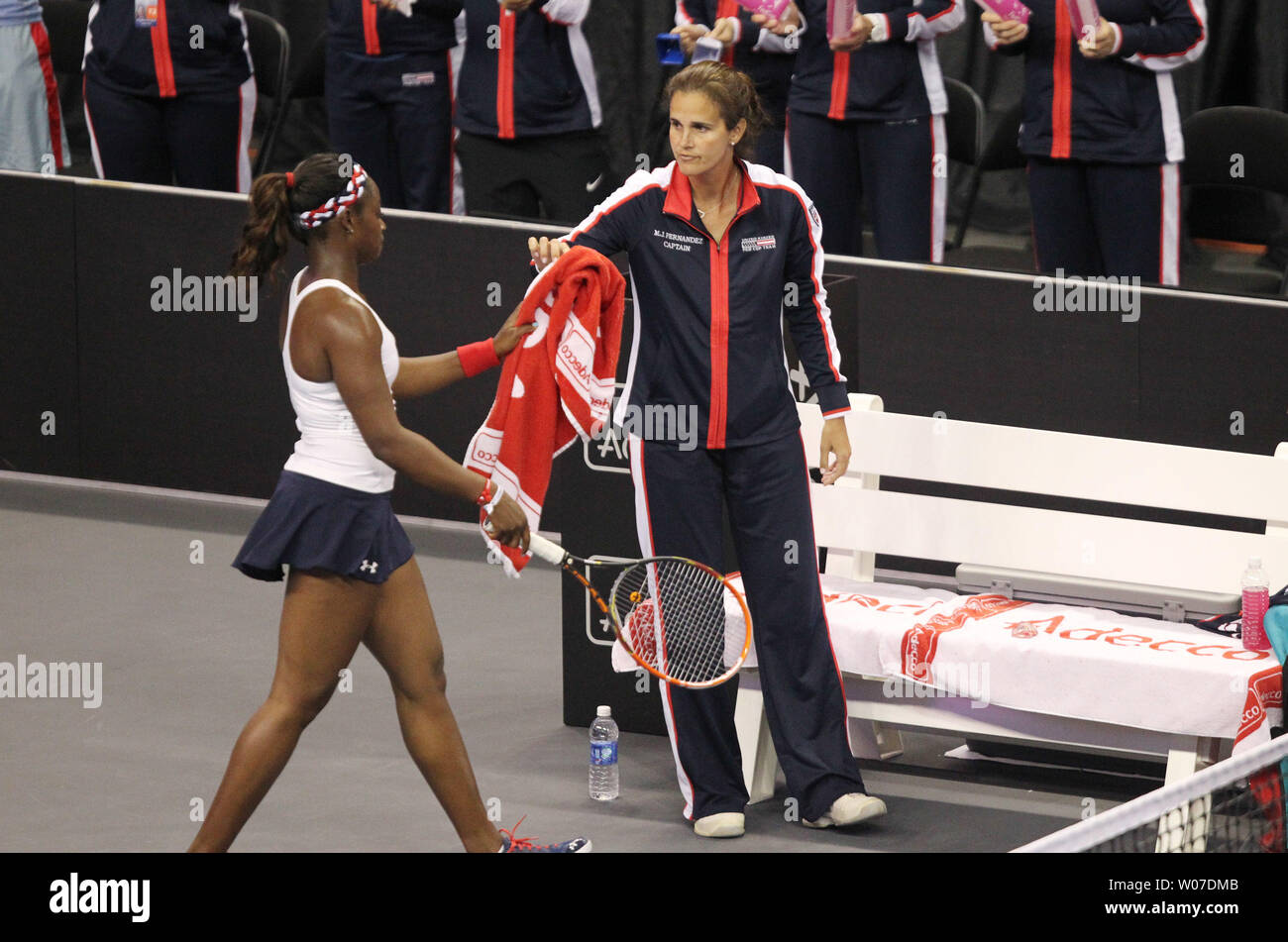 United States captain Mary Joe Fernandez hands a towel to Sloane Stephens  during the Fed Cup Tennis 2014 World Group Playoff at the Chaifetz Arena in  St. Louis on April 20, 2014.