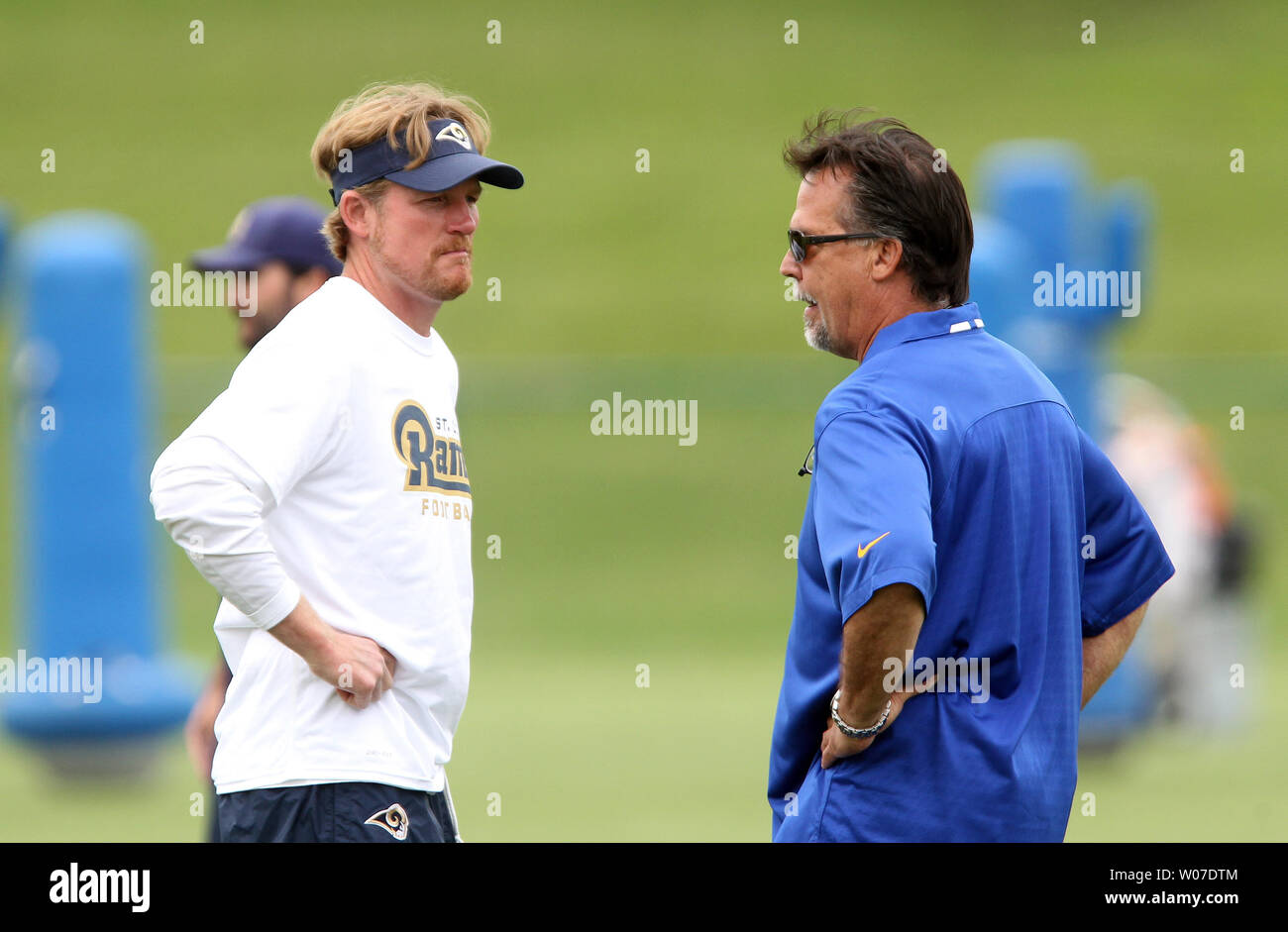 St. Louis Rams head football coach Jeff Fisher (R) talks with General Manager Les Snead during the first day of organized team activities at Rams Park in Earth City, Missouri on June 5, 2014.    UPI/Bill Greenblatt Stock Photo