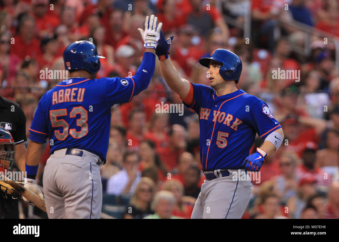 New York Mets David Wright is greeted at home plate by Bobby Abreu after  Wright hit a solo home run in the fourth inning against the St. Louis  Cardinals at Busch Stadium