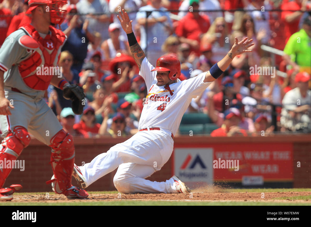 St. Louis Cardinals Yadier Molina slides into home plate safely