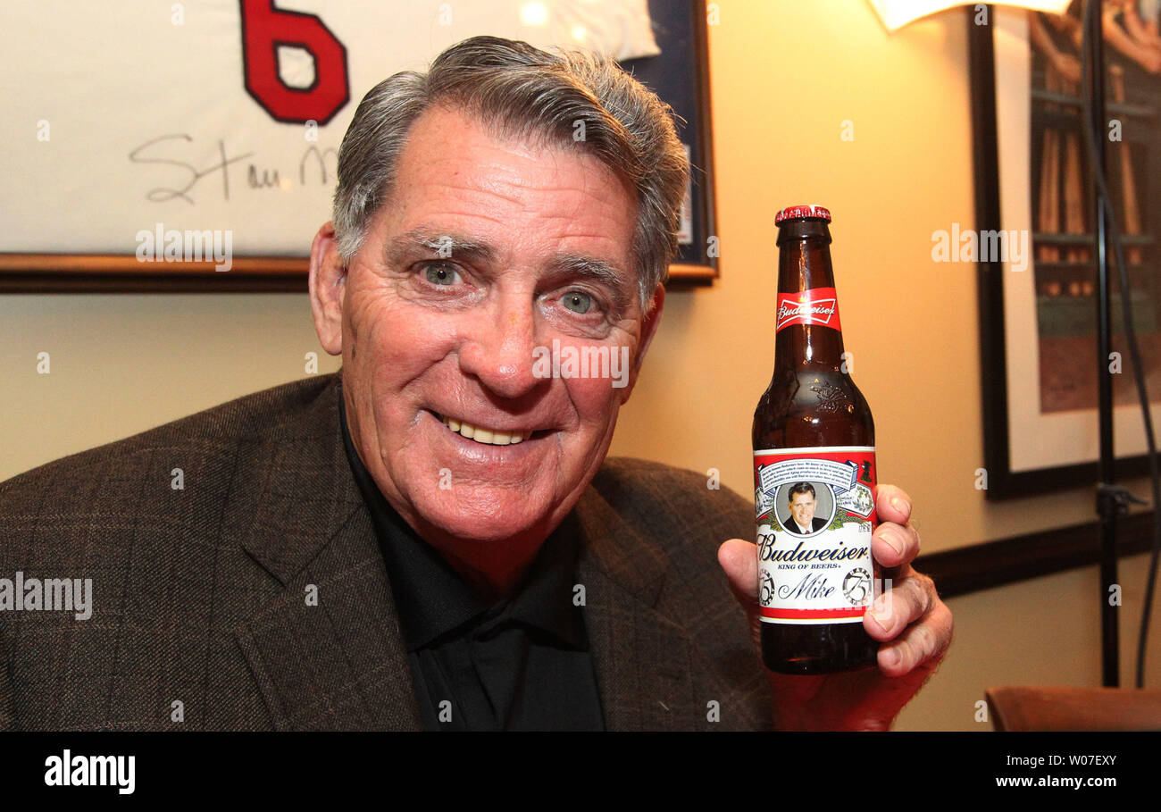 St. Louis Cardinals broadcaster Mike Shannon shows off a specially made  Budwesier bottle with his picture as he celebrates his 75th birthday with  family and friends at Mike Shannon's Steak and Seafood