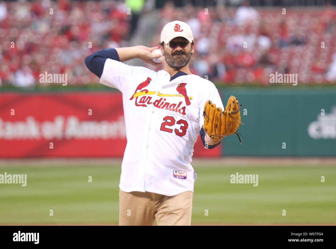 Native St. Louisian and avid Cardinals fan, actor Jon Hamm throws a ceremonial first pitch before the Cincinnati Reds-St