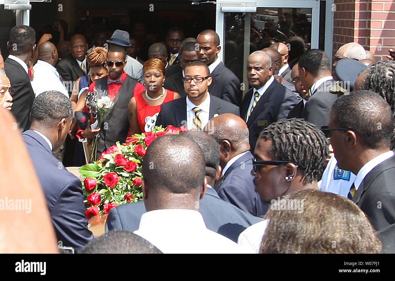 The remains of Michael Brown Jr. prepare to leave the Friendly Temple Missionary Baptist Church at the completion of his funeral in St. Louis on August 25, 2014. Brown gained attention after he was shot by a white Ferguson, Missouri police officer on August 9 and was unarmed. The shooting led to several nights of looting, arrests and heavy police presence.   UPI/Bill Greenblatt Stock Photo