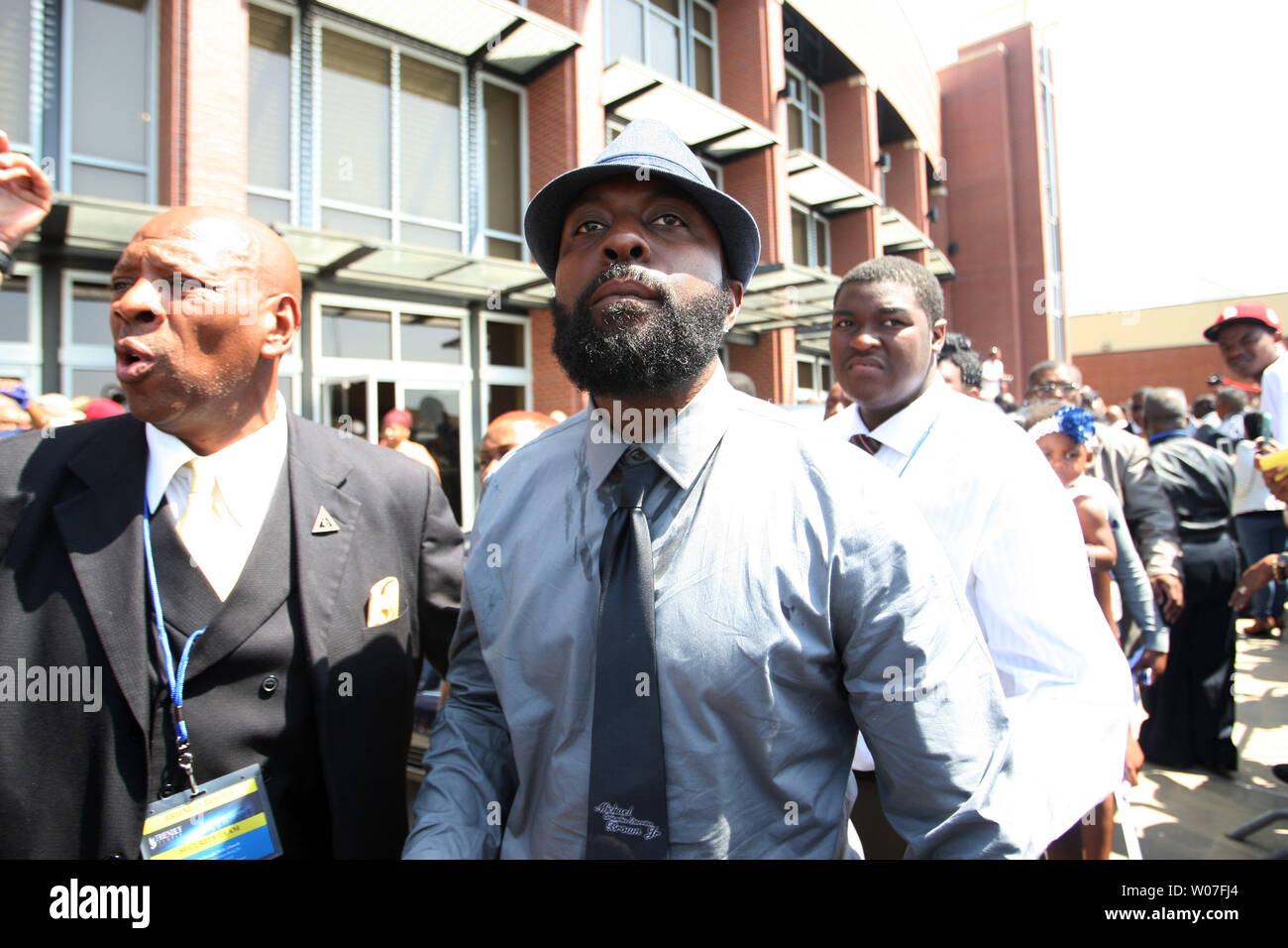 Michael Brown Sr. leaves the Friendly Temple Missionary Baptist Church at the completion of the funeral for his son Michael Brown Jr.  in St. Louis on August 25, 2014. Brown gained attention after was shot by a white Ferguson, Missouri police officer on August 9 and was unarmed. The shooting led to several nights of looting, arrests and heavy police presence.   UPI/Bill Greenblatt Stock Photo