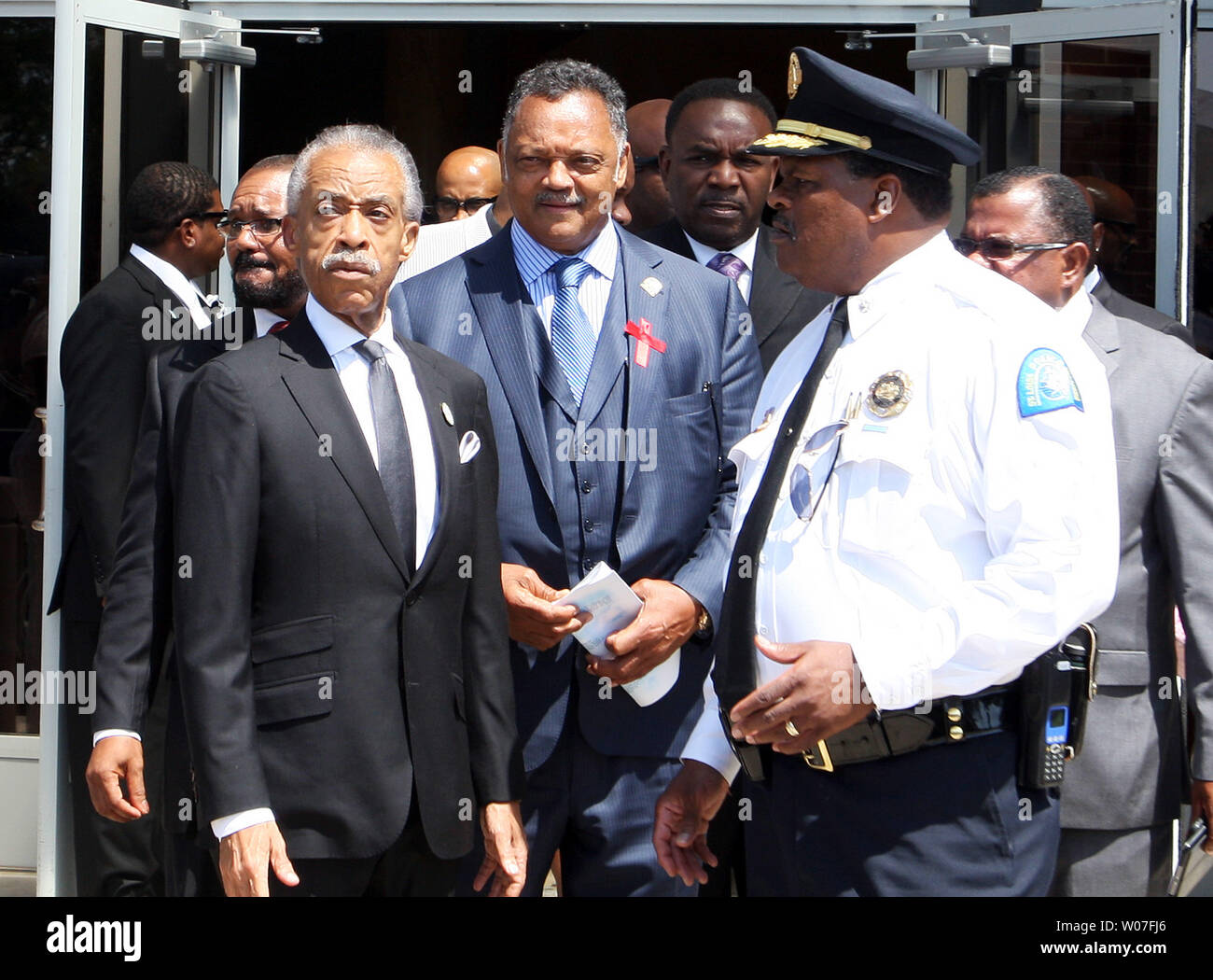 Rev. Jessie Jackson and Rev. Al Sharpton leave the Friendly Temple Missionary Baptist Church at the completion of the funeral for Michael Brown Jr. in St. Louis on August 25, 2014. Brown gained attention after was shot by a white Ferguson, Missouri police officer on August 9 and was unarmed. The shooting led to several nights of looting, arrests and heavy police presence.   UPI/Bill Greenblatt Stock Photo