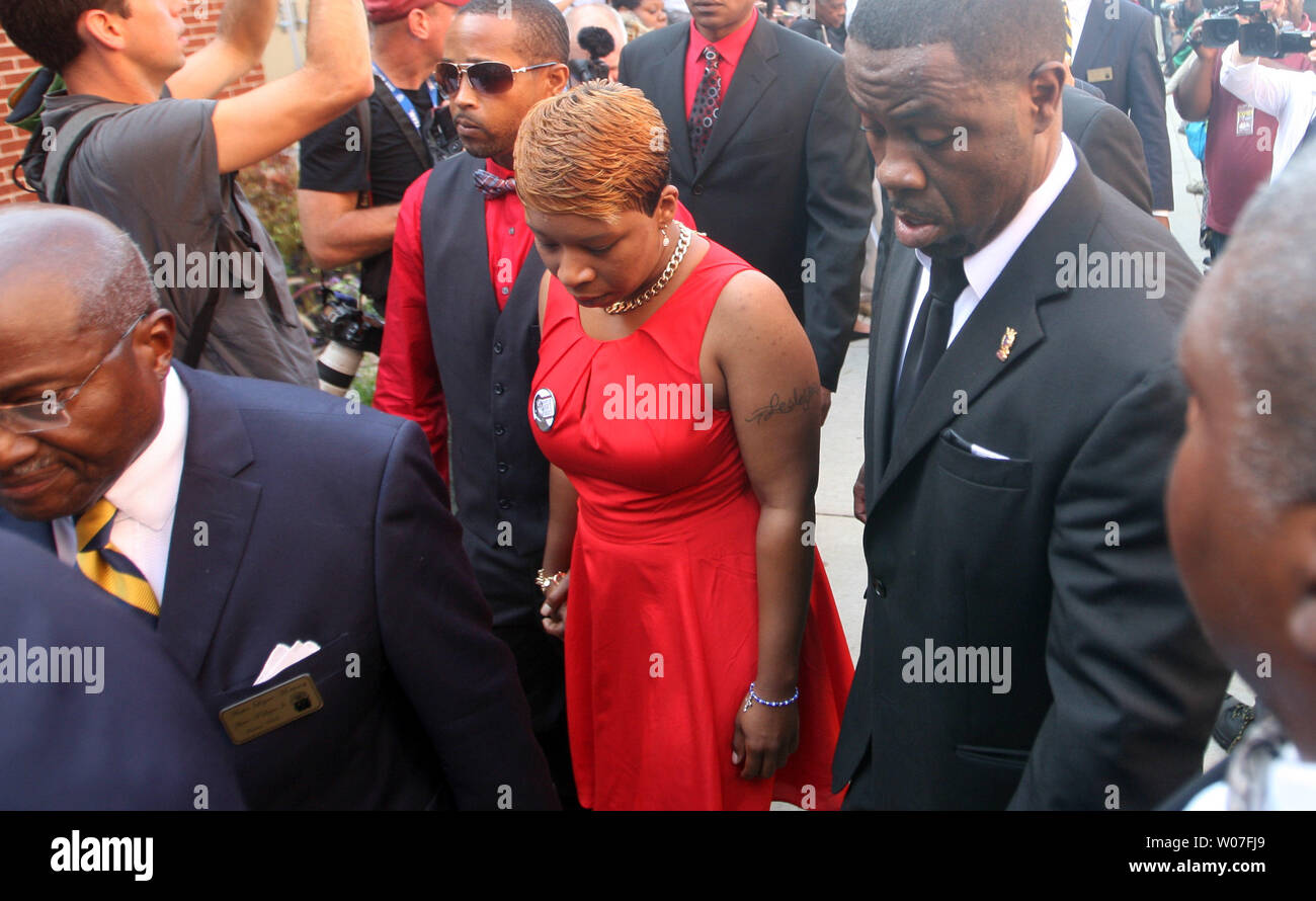 Lesley McSpadden arrives for the funeral of her son Michael Brown Jr. at the Friendly Temple Missionary Baptist Church in St. Louis on August 25, 2014. Brown gained attention after was shot by a white Ferguson, Missouri police officer on August 9 and was unarmed. The shooting led to several nights of looting, arrests and heavy police presence.   UPI/Bill Greenblatt Stock Photo