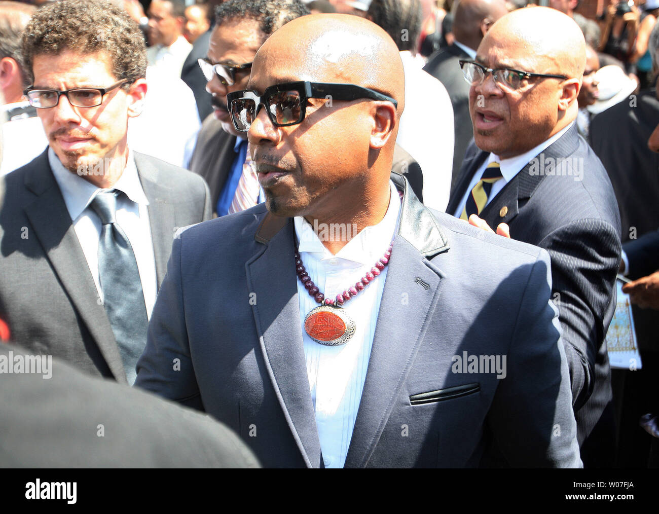 Rapper MC Hammer leaves the Friendly Temple Missionary Baptist Church at the completion of the funeral for Michael Brown Jr. in St. Louis on August 25, 2014. Brown gained attention after was shot by a white Ferguson, Missouri police officer on August 9 and was unarmed. The shooting led to several nights of looting, arrests and heavy police presence.   UPI/Bill Greenblatt Stock Photo