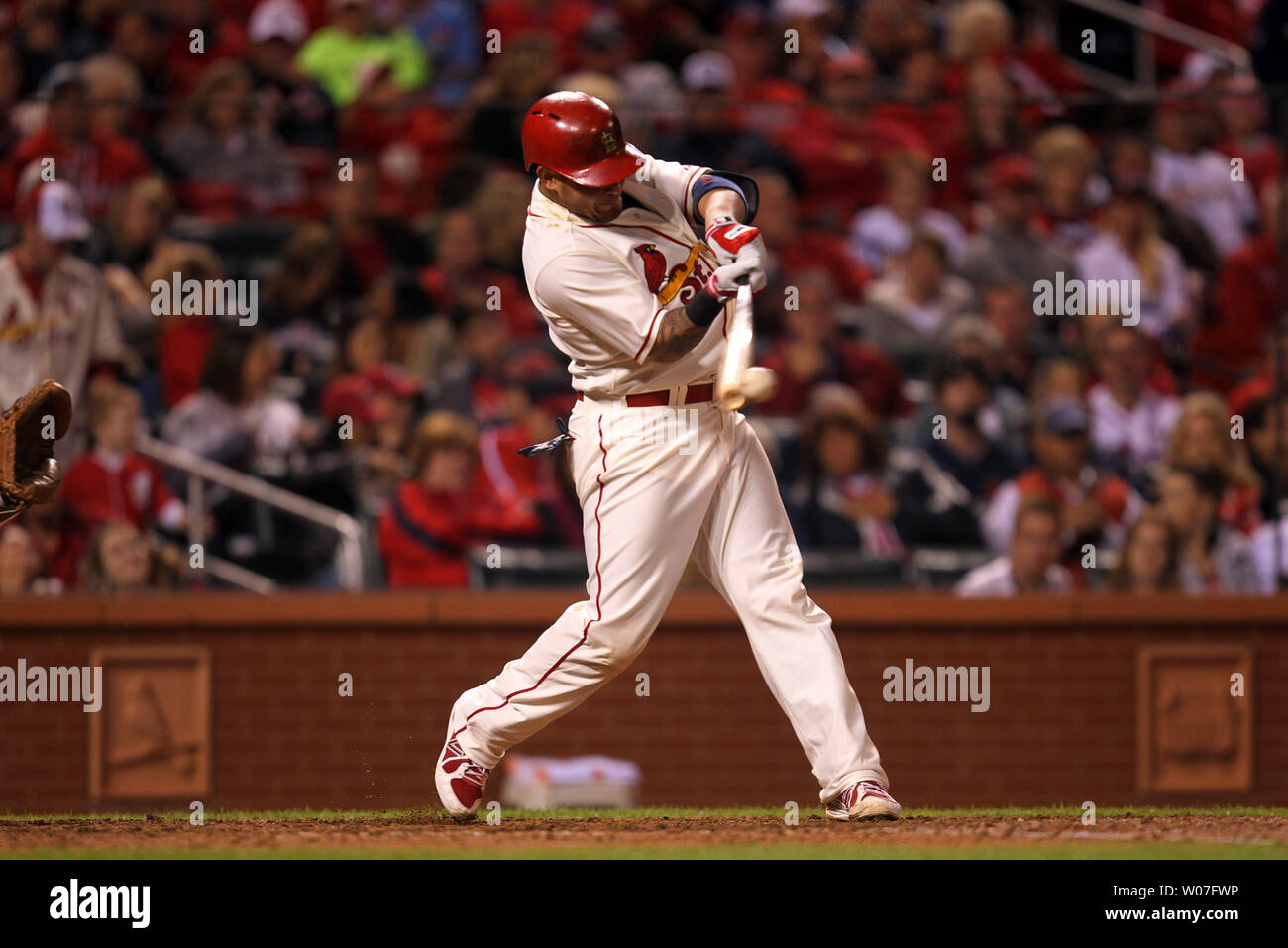 St. Louis Cardinals Yadier Molina swings hitting a single in the sixth