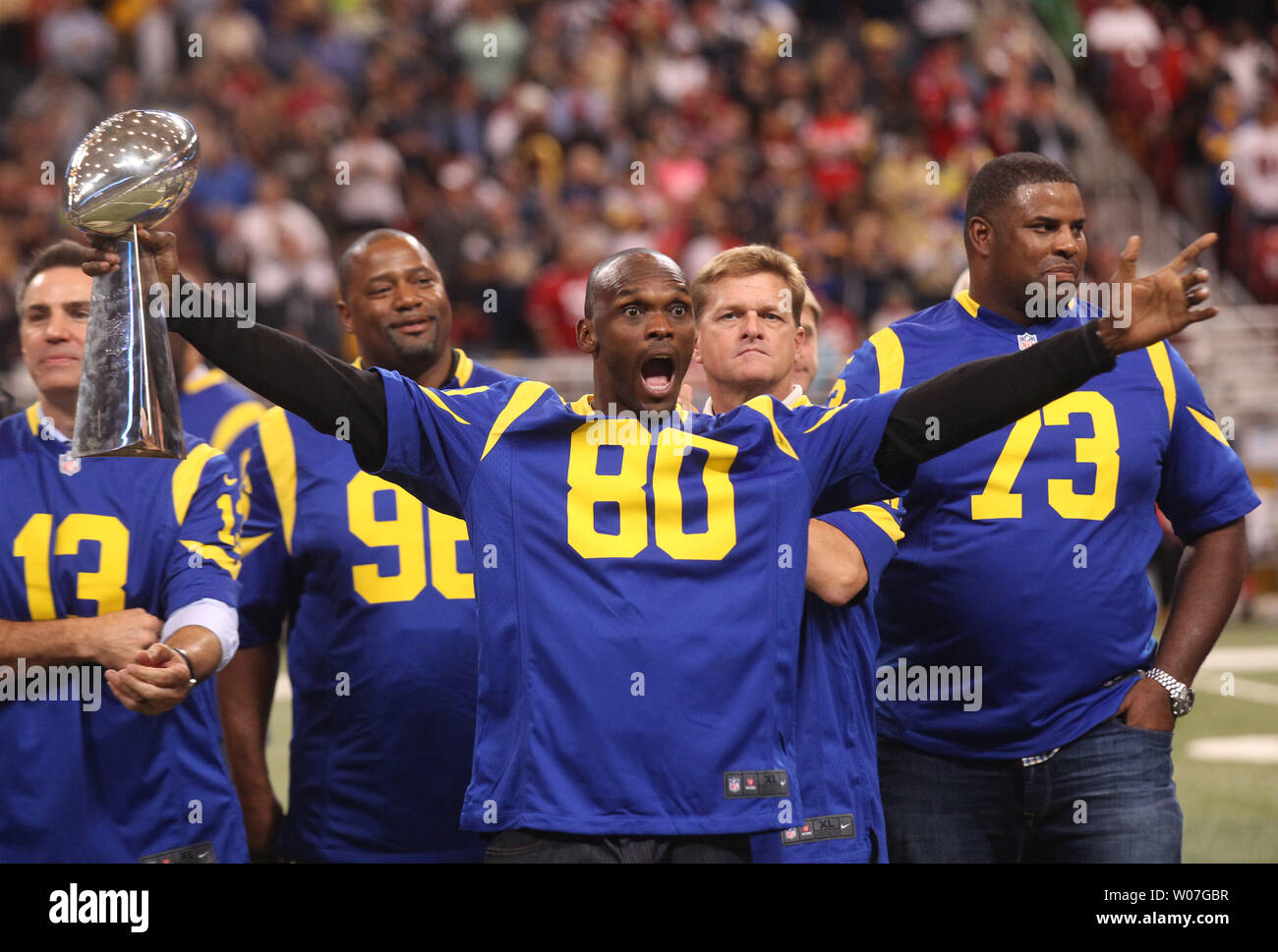 Former St. Louis Rams Isaac Bruce holds the Super Bowl trophy during  ceremonies celebrating the teams Super Bowl victory in the 1999-2000  season, at the Edward Jones Dome during half time of