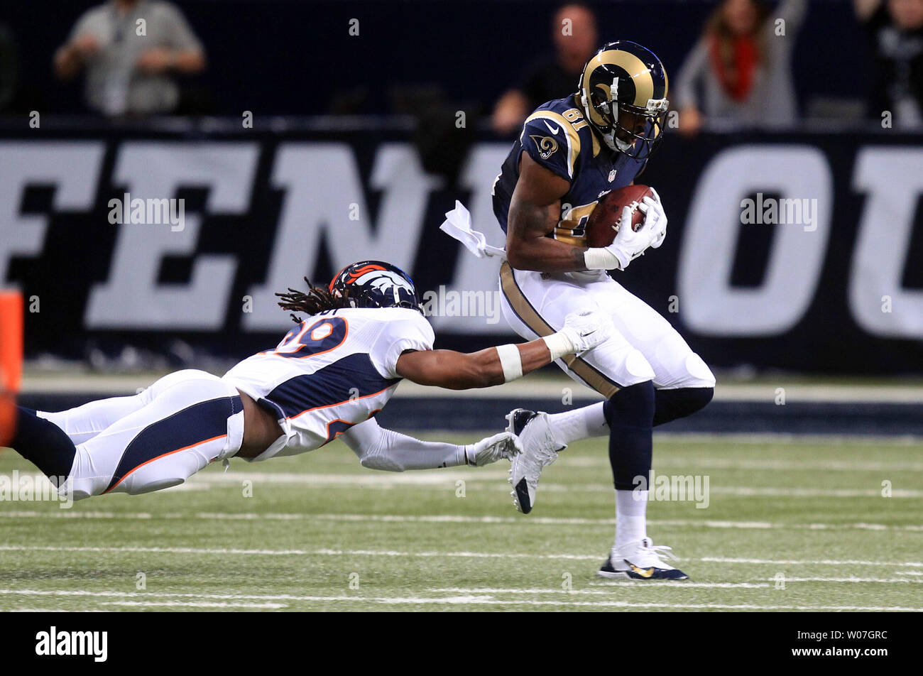 St. Louis Rams Kenny Britt catches the football in front of the diving Denver Broncos Bradley Roby for a 63 yard touchdown in the first quarter at the Edward Jones Dome in St. Louis on November 16, 2014. UPI/Bill Greenblatt Stock Photo