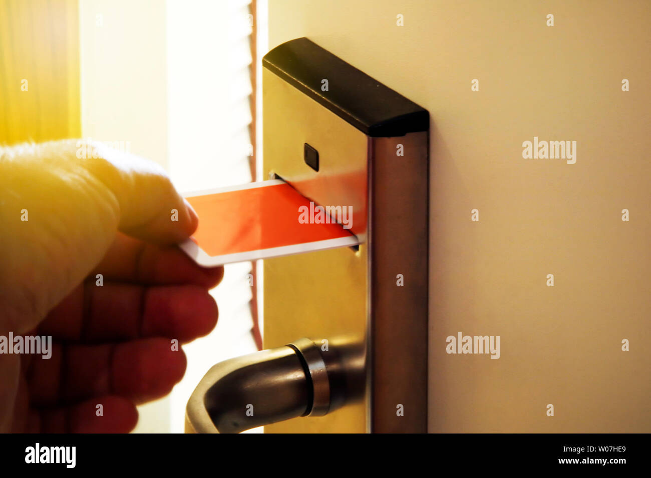Person Unlocking Keycard door Lock Stock Photo