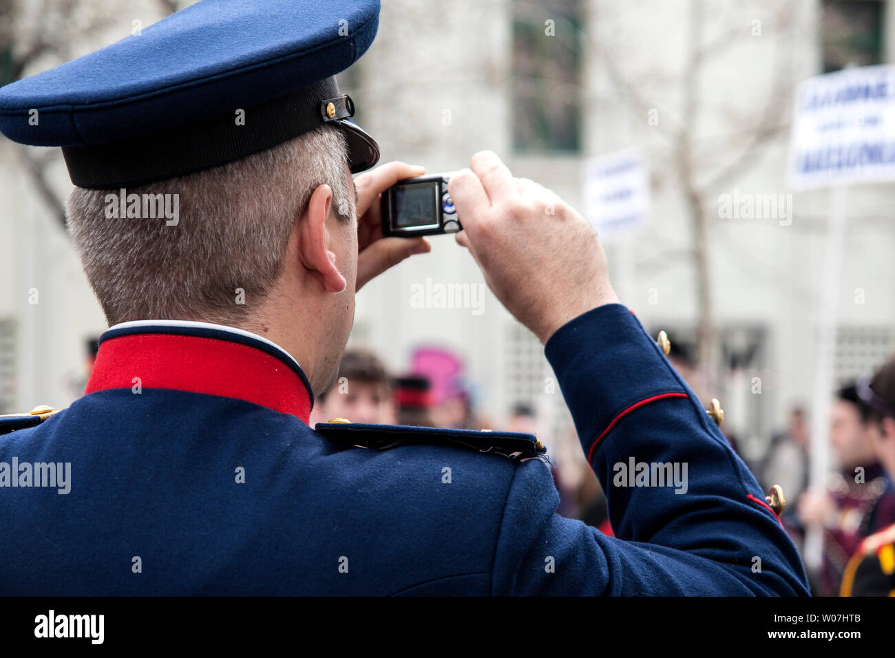 Men with uniform take a picture with his phone Stock Photo