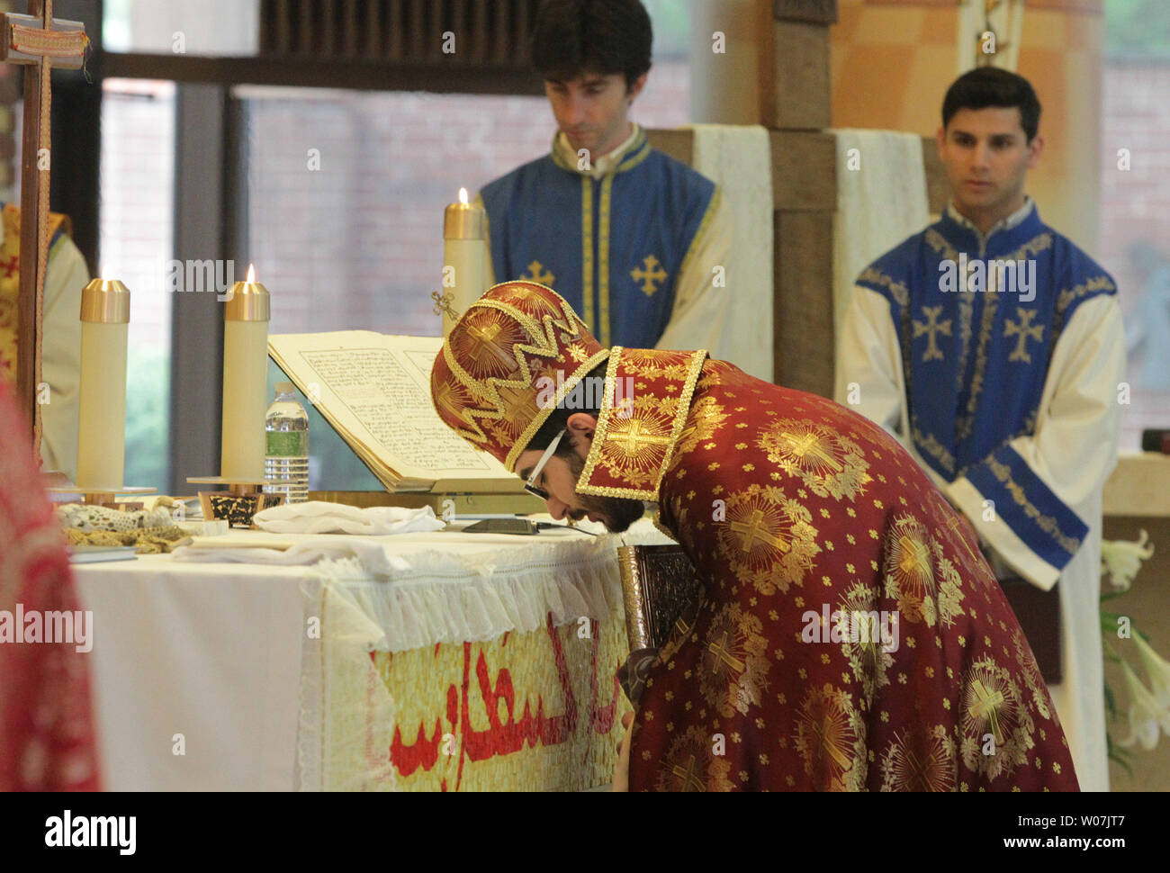 Rev. Torkom Chorbajian preforms a ceremony observing the 100th