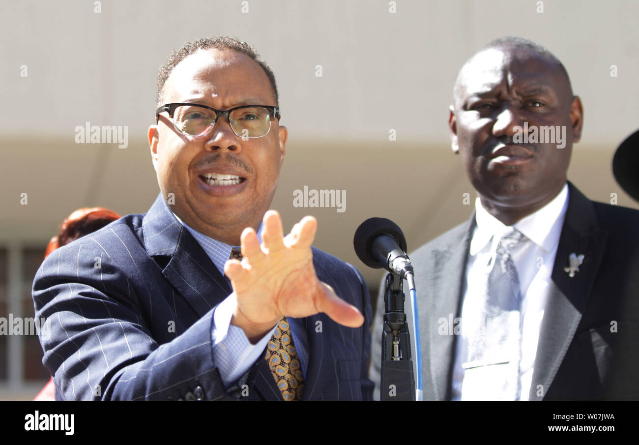 Family attorney Anthony Gray announces that the parents of Michael Brown have filed a civil lawsuit in the August 9, 2014 shooting death of their son Michael by Ferguson Police Officer Darren Wilson, as attorney Benjamin Crump (R) stand outside the St. Louis County Courts building in Clayton, Missouri on April 23, 2015. The suit seeks $75,000 in damages, in addition to attorney fees. Photo by Bill Greenblatt/UPI Stock Photo