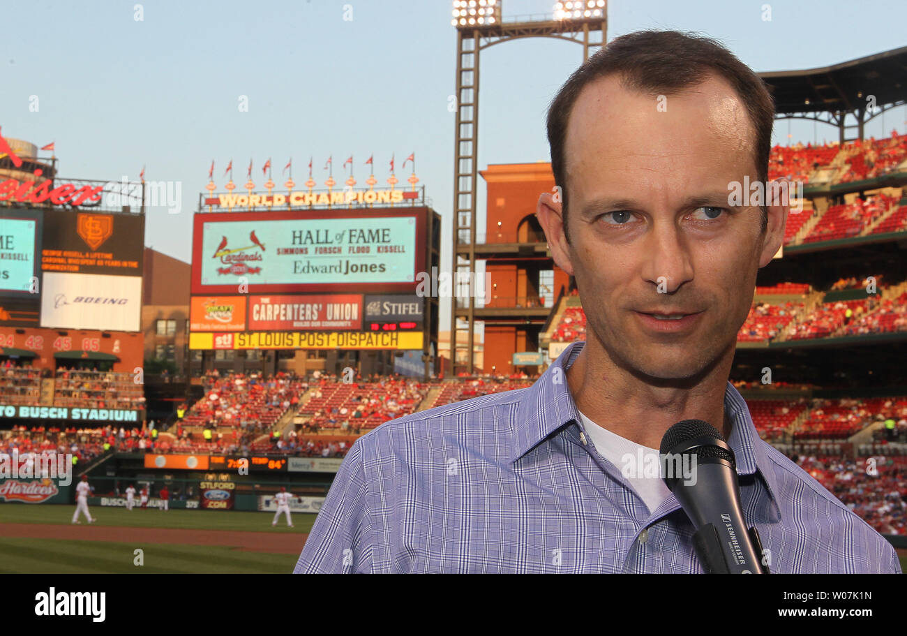 St. Louis Cardinals President Bill DeWitt III (R) points out the highlights  of the team's new uniform on pitcher Trevor Rosenthal at Busch Stadium in St.  Louis on November 16, 2012. For