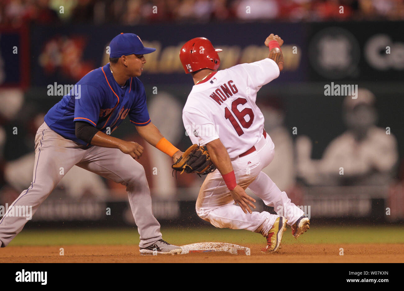 New York Mets Ruben Tejada tags St. Louis Cardinals Kolten Wong without the ball as Wong steals second base in the sixth inning at Busch Stadium in St. Louis on July 17, 2015. Wong went to third as the ball went to center field. Photo by Bill Greenblatt/UPI Stock Photo