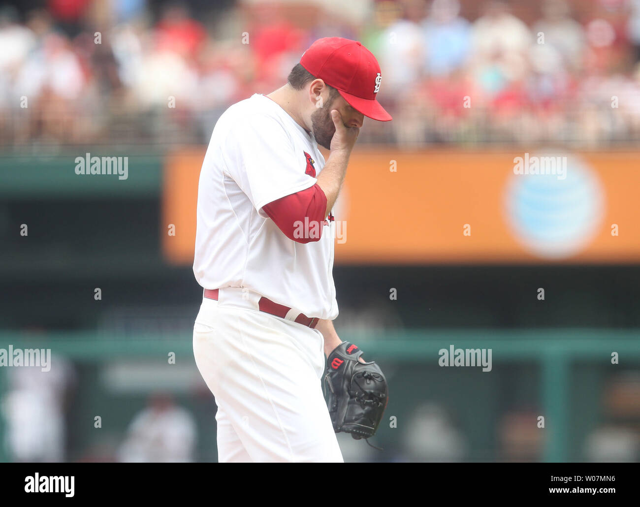 St. Louis Cardinals starting pitcher Lance Lynn wipes his face as he leaves the game in the third inning againt the Chicago Cubs at Busch Stadium in St. Louis on September 7, 2015. Lynn gave up  seven runs. Photo by Bill Greenblatt Stock Photo
