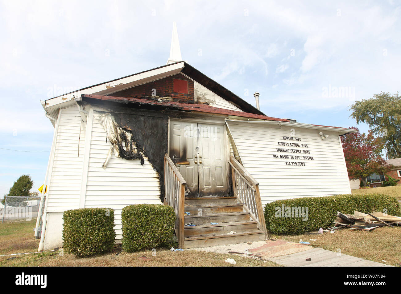 The Newlife Missionary Baptist Church in north St. Louis as it sits with the front burned on October 20, 2015. An incendiary fire on October 17, 2015, damaged the front doors, siding and an entrance to the small Africian-American church. The fire is the sixth of its type in the the last two weeks. Police and the ATF have also been investigating the fires.    Photo by Bill Greenblatt/UPI Stock Photo