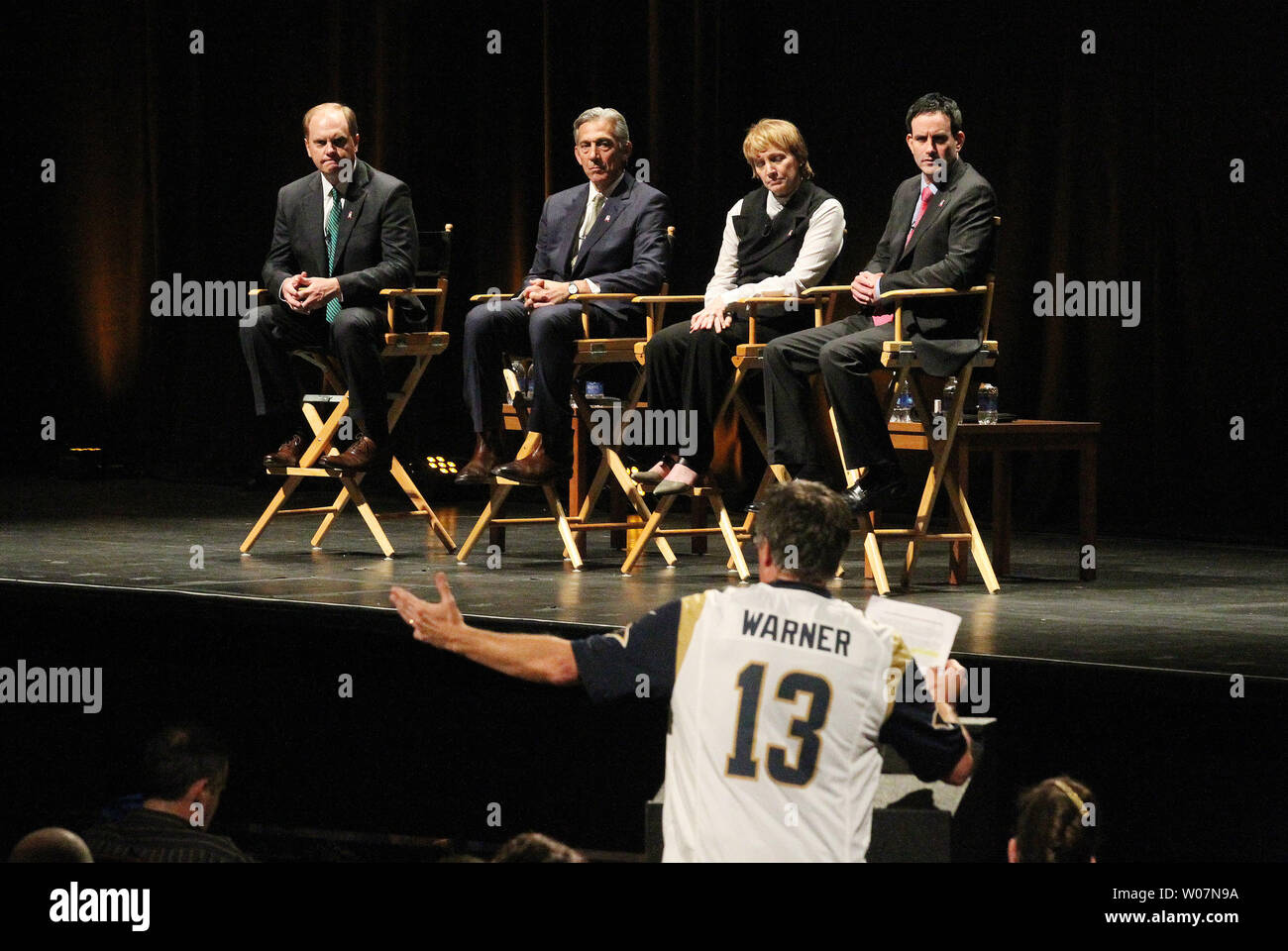 A St. Louis Rams fan wearing a Kurt Warner jersey makes his remarks in favor of the St. Louis Rams remaining in St. Louis during a town hall meeting at the Peabody Opera House in St. Louis on October 27, 2015. Representing the National Football League are (L to R) Chris Hardart, Eric Grubman, Cynthia Hogan and.Jay Bauman. The Rams owner Stan Kronke has hinted that he wants to move the team to Los Angeles. Town hall meetings are also scheduled for Oakland and San Diego. Photo by Bill Greenblatt/UPI Stock Photo