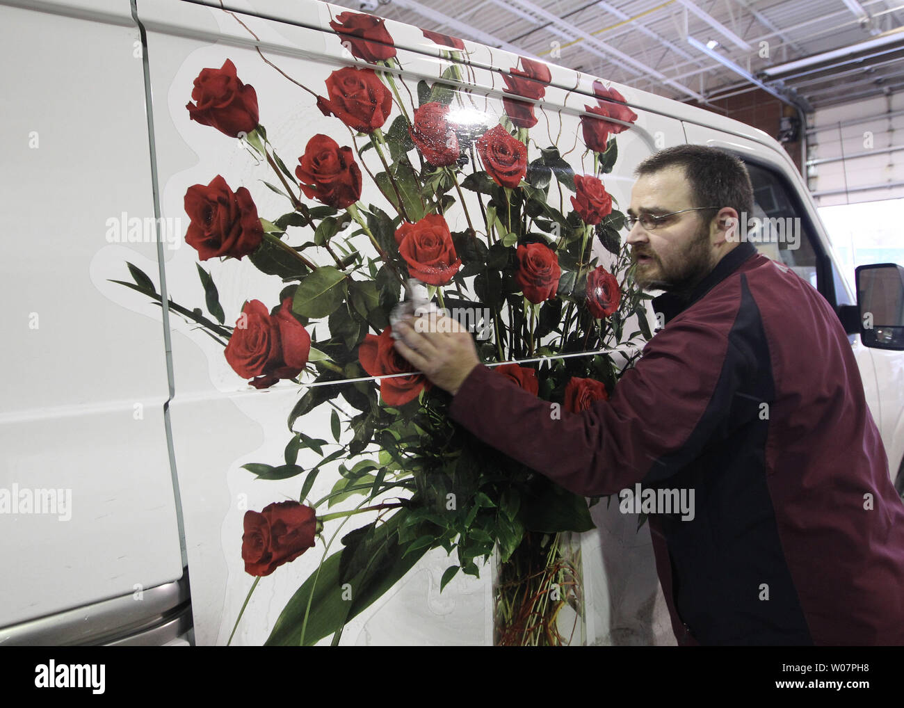 Jerry Ferguson wipes a delivery truck on February 10, 2016 as