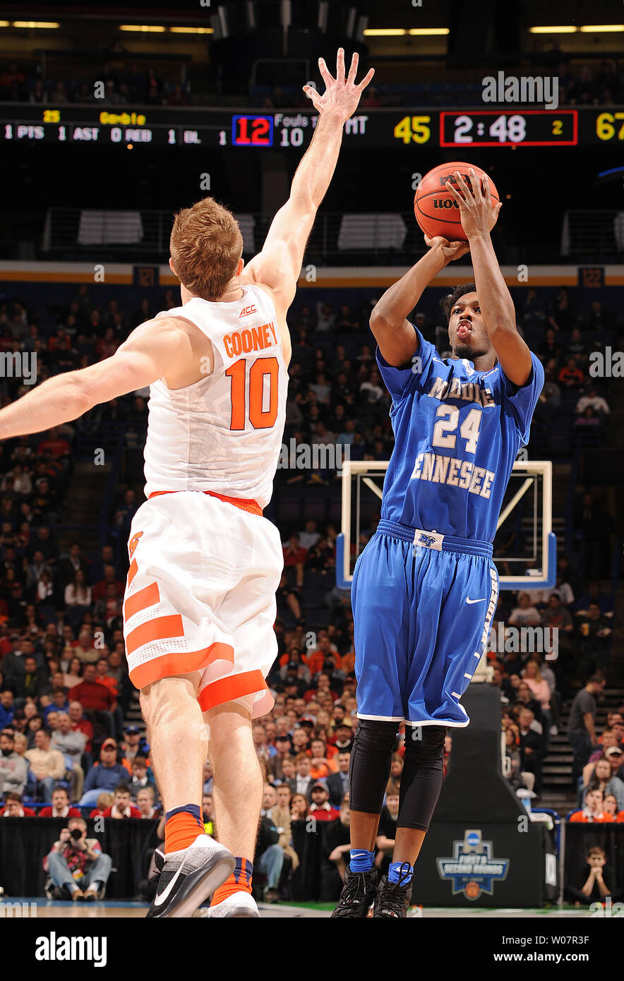 Middle Tennessee's guard Quavius Copeland shoots over Syracuse guard Trevor Cooney during the second half of play in the NCAA Division 1 Men's Basketball Championship at the Scottrade Center in St. Louis on March 20, 2016. Syracuse defeated Middle Tennessee 75-50.      Photo by Doug Devoe/UPI Stock Photo