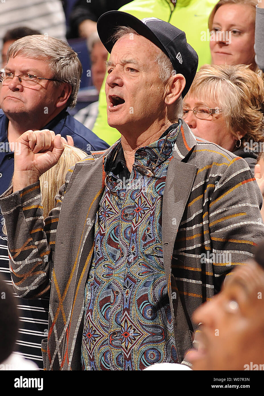 Actor Bill Murray cheers on Xavier from behind their bench as they play Wisconsin in the NCAA Division 1 Men's Basketball Championship at the Scottrade Center in St. Louis on March 20, 2016. Murray's son Luke is an assistant coach with the team. Wisconsin defeated Xavier, 66-63.    Photo by Doug Devoe/UPI Stock Photo