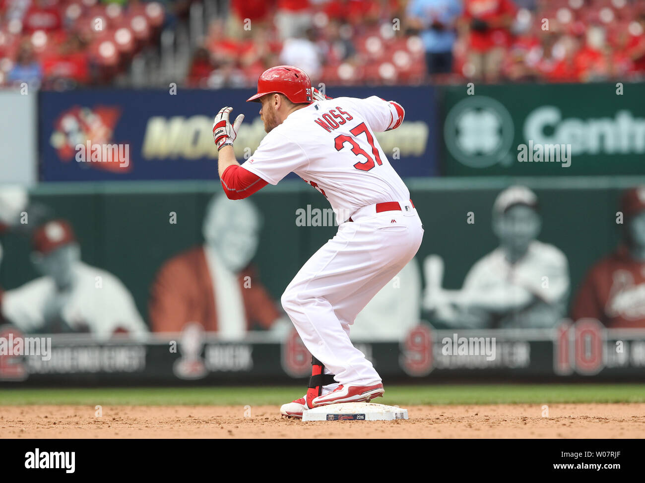 St. Louis Cardinals Brandon Moss ducks as he stands on second base startled by the sound of fireworks after hitting a solo home run in the ninth inning against the Washington Nationals